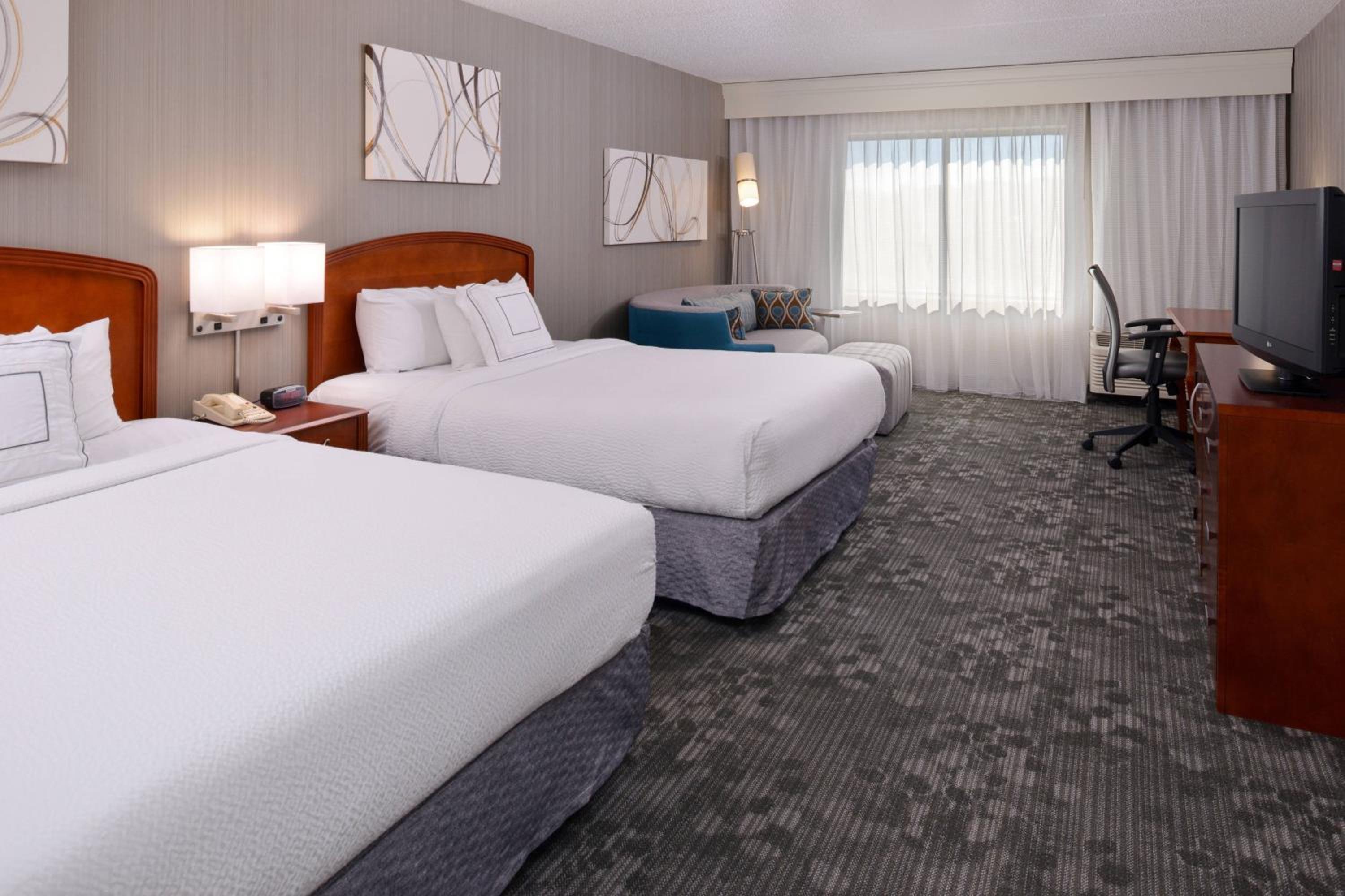 Queen Room with Two Queen Beds and Sofa Bed - Hearing Accessible - Photo 1