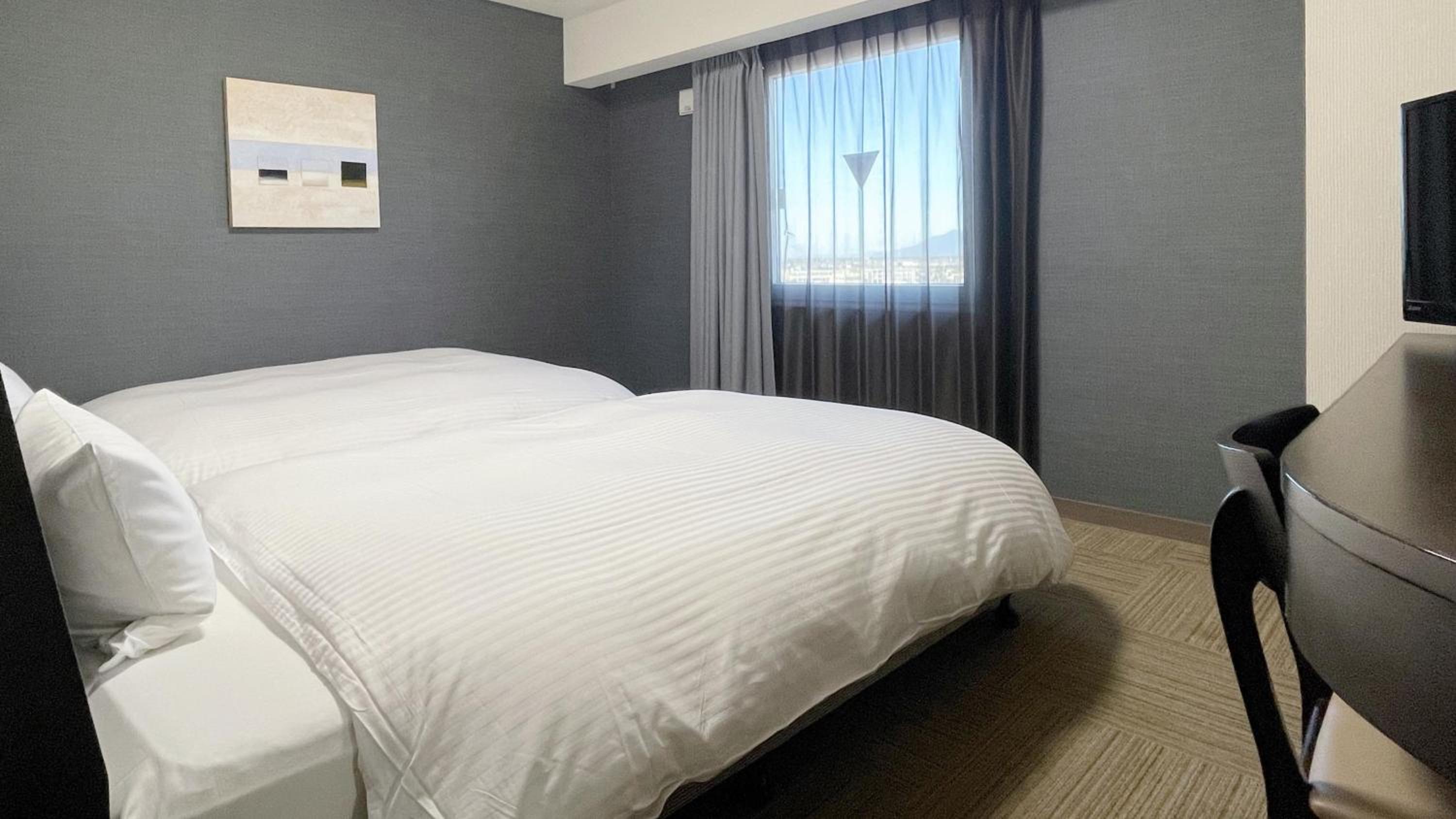 Twin Room - Non-Smoking - No Daily Cleaning - Photo 4