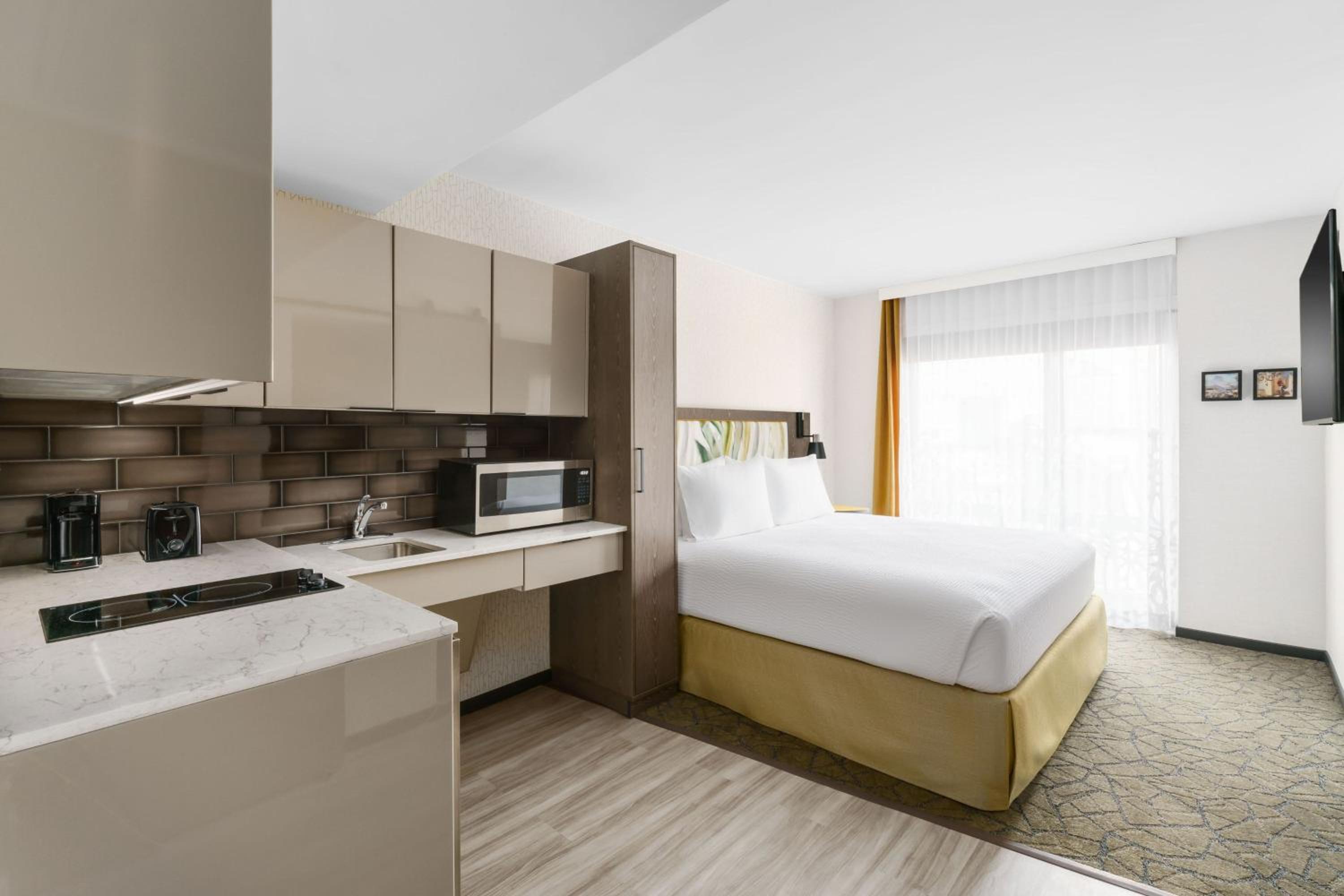 King Studio with Partial City View and Full Kitchenette - Mobility/Hearing Accessible w/Roll In Shower