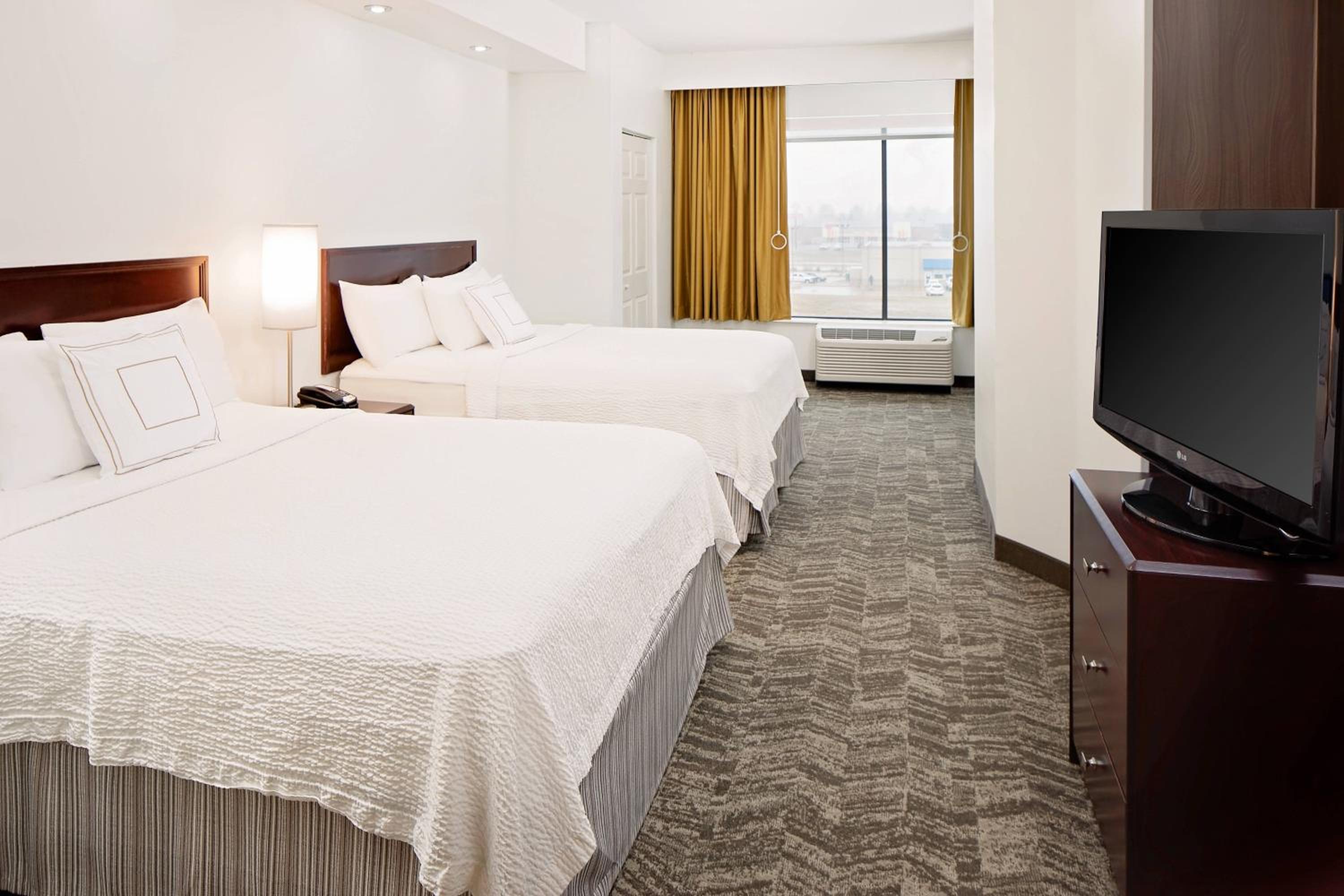 Queen Suite with Two Queen Beds and Sofa Bed - Photo 1