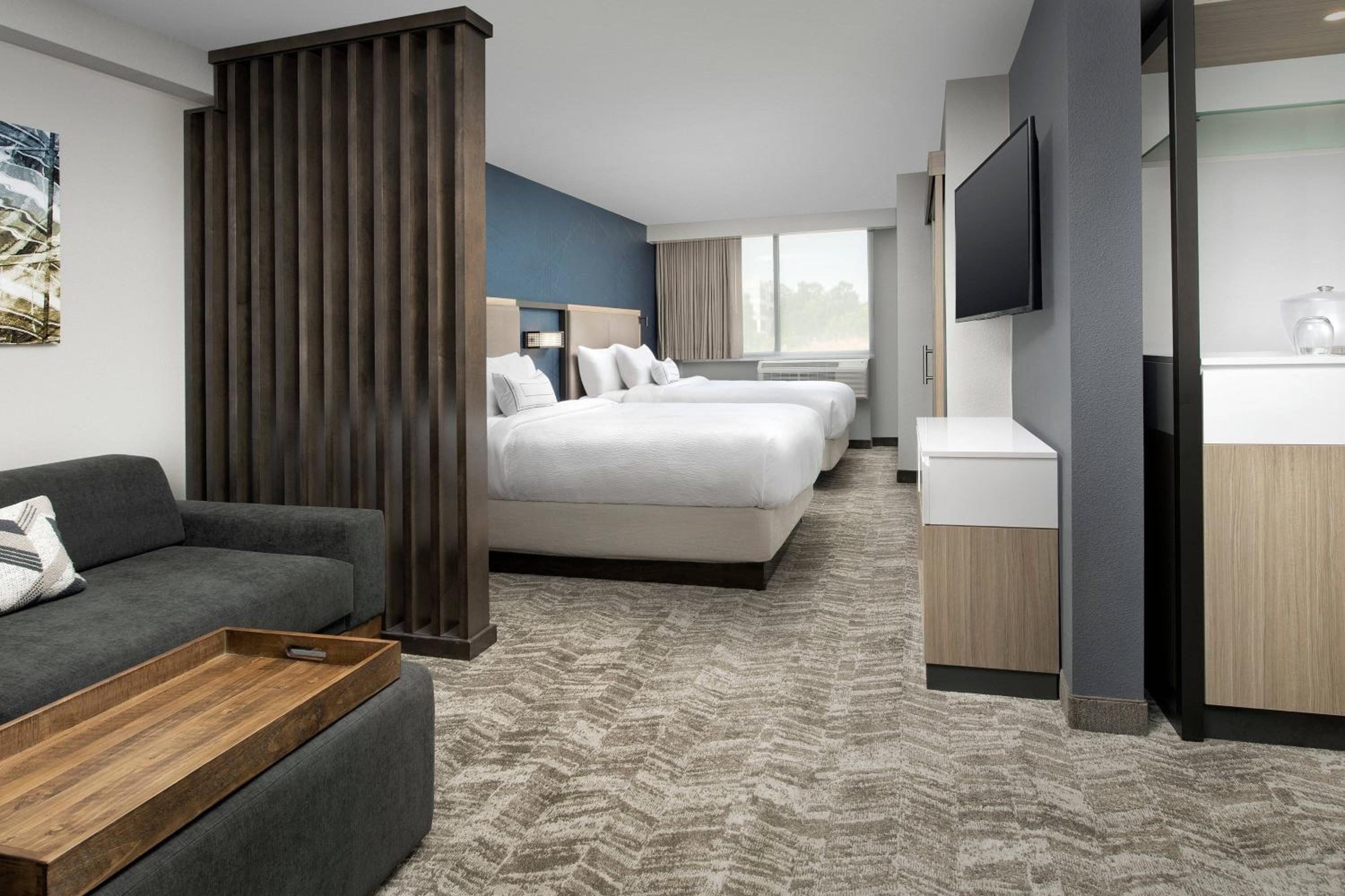 Queen Suite with Two Queen Beds and Sofa Bed - Photo 1