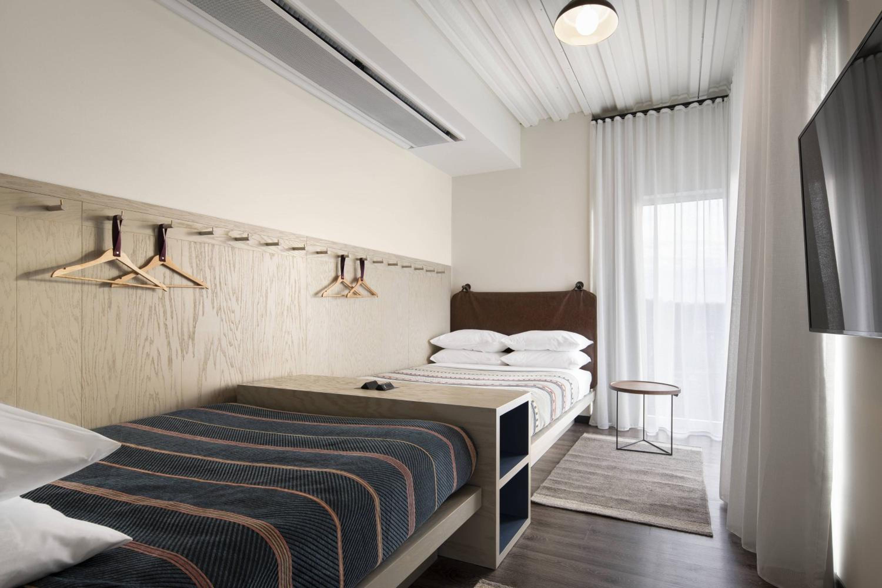 Queen Suite with Two Queen Beds and Trundle Sofa - Photo 1