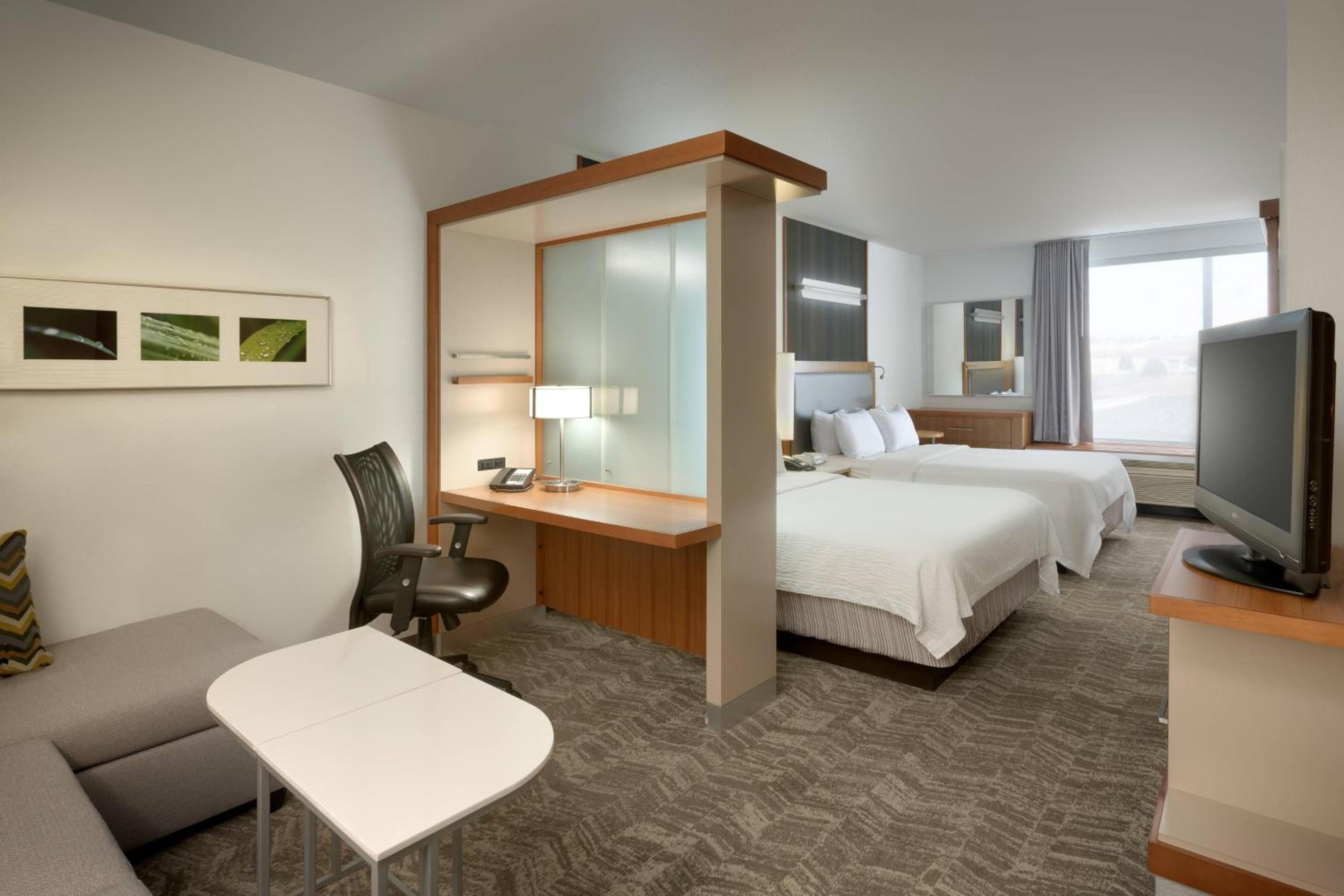 Queen Suite with Two Queen Beds and Sofa Bed - Photo 1
