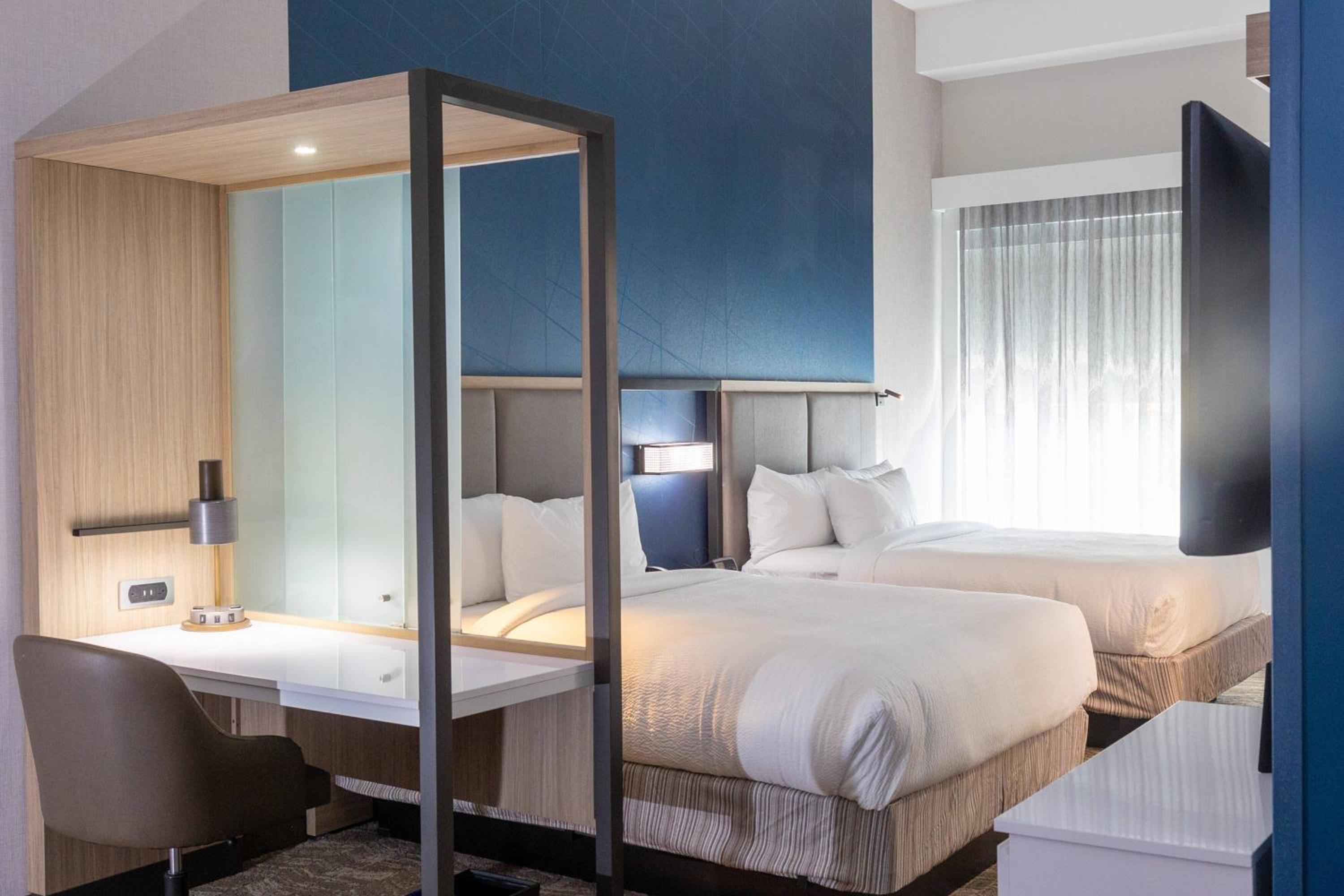 Queen Suite with Two Queen Beds and Trundle Sofa - Photo 1