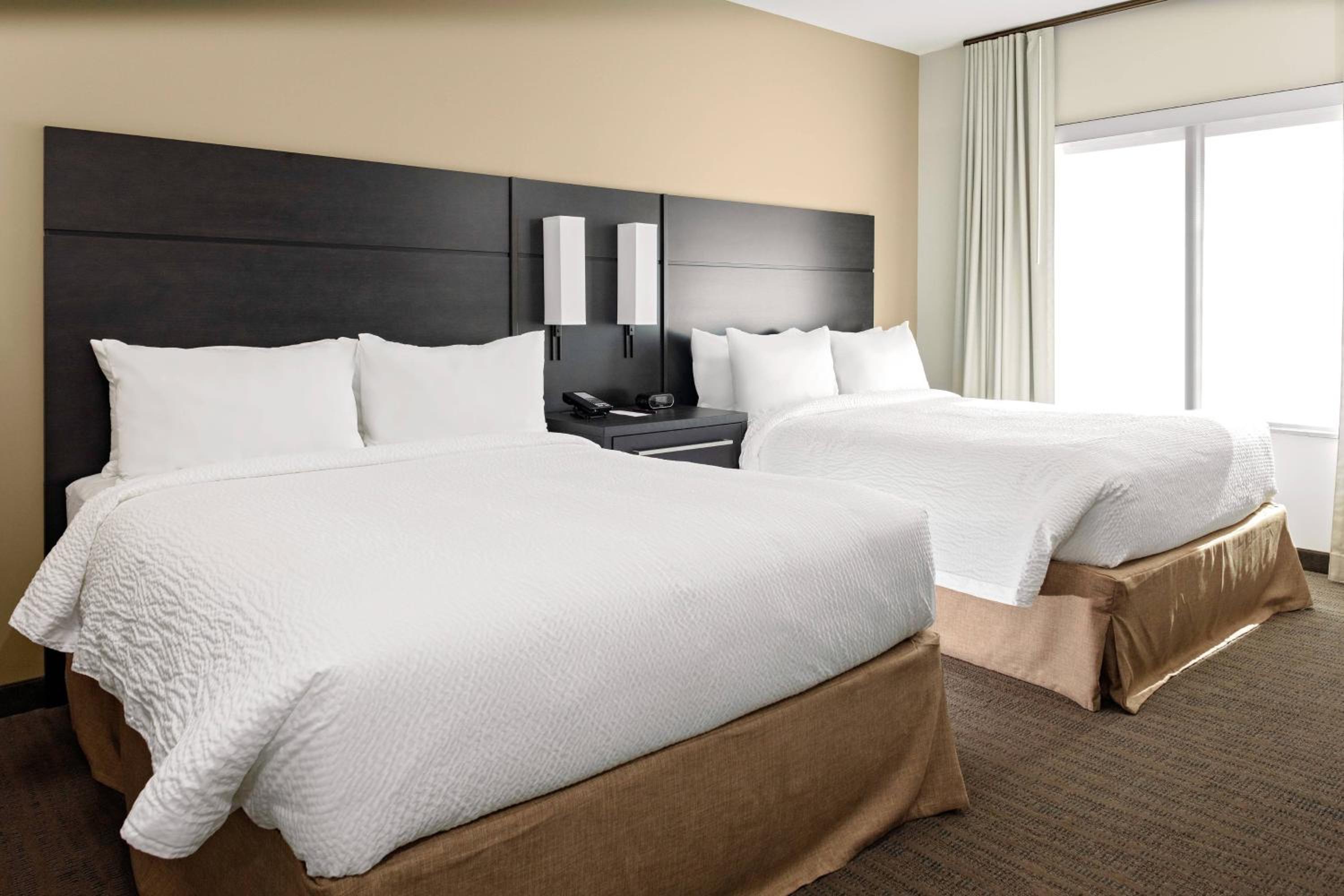 One-Bedroom Queen Corner Suite with Two Queen Beds and Sofa Bed - Hearing Accessible photo 1
