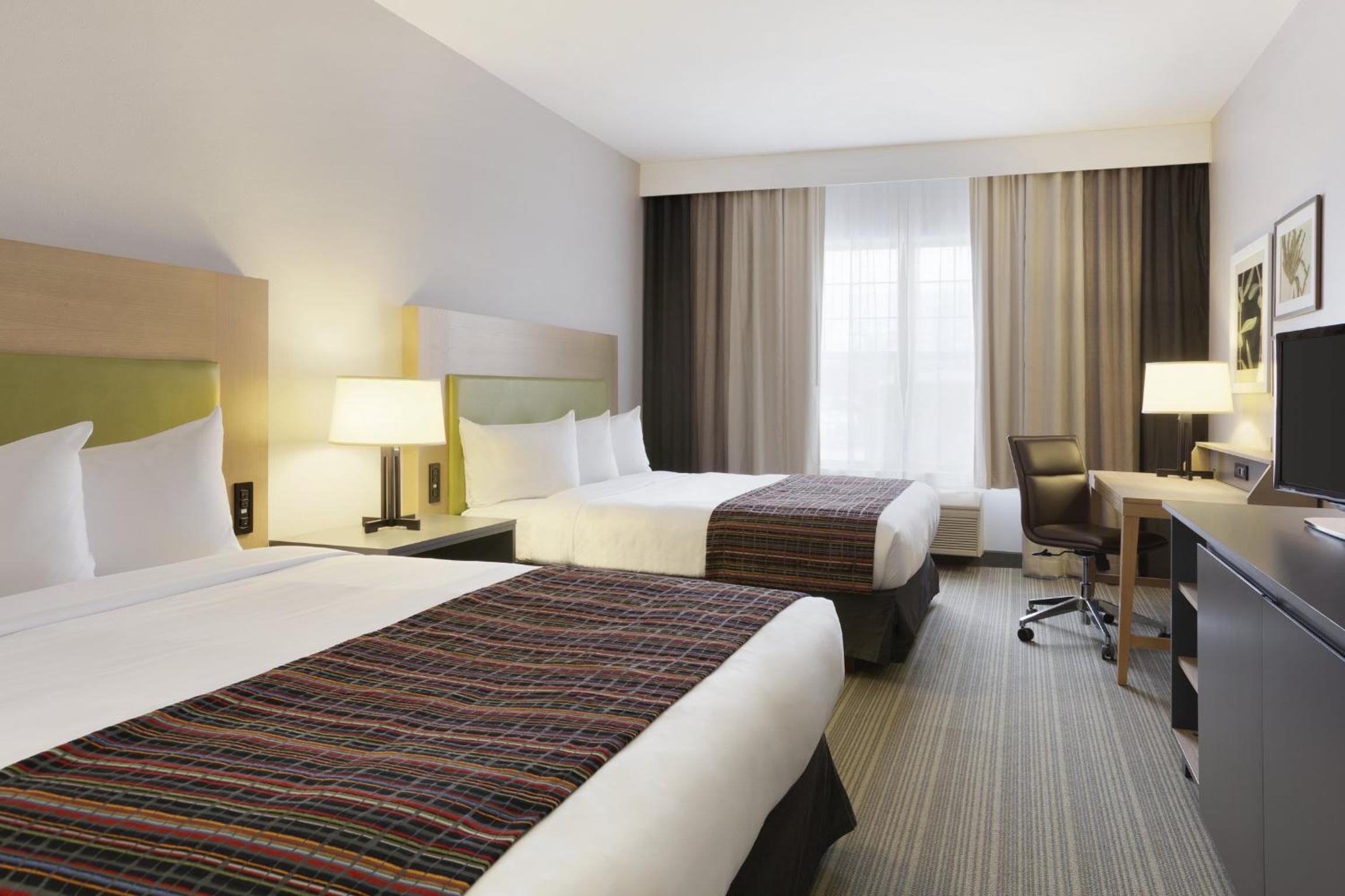 Queen Room with Two Queen Beds - Photo 1