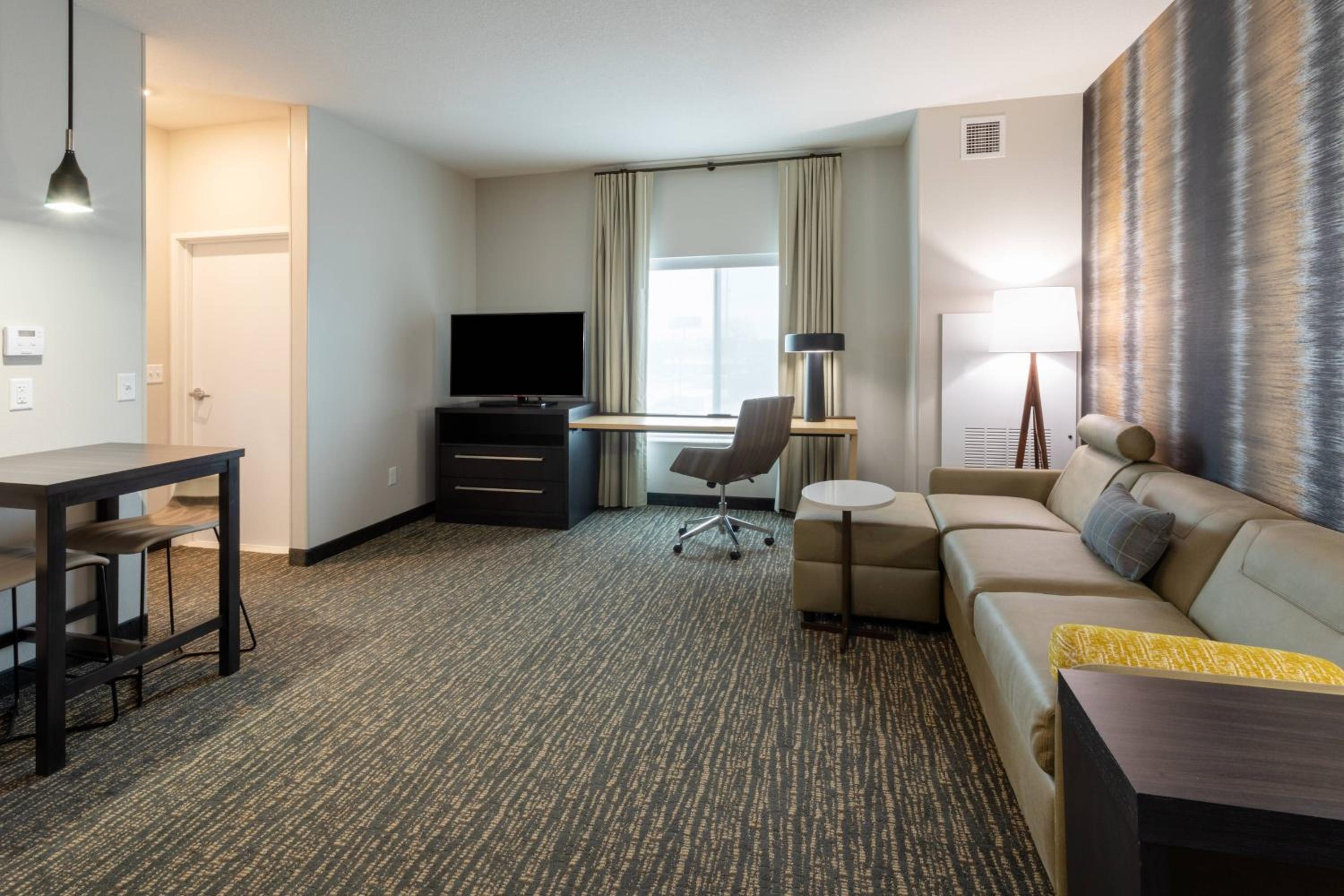One-Bedroom King Suite with Sofa Bed and Roll-In Shower - Hearing Accessible