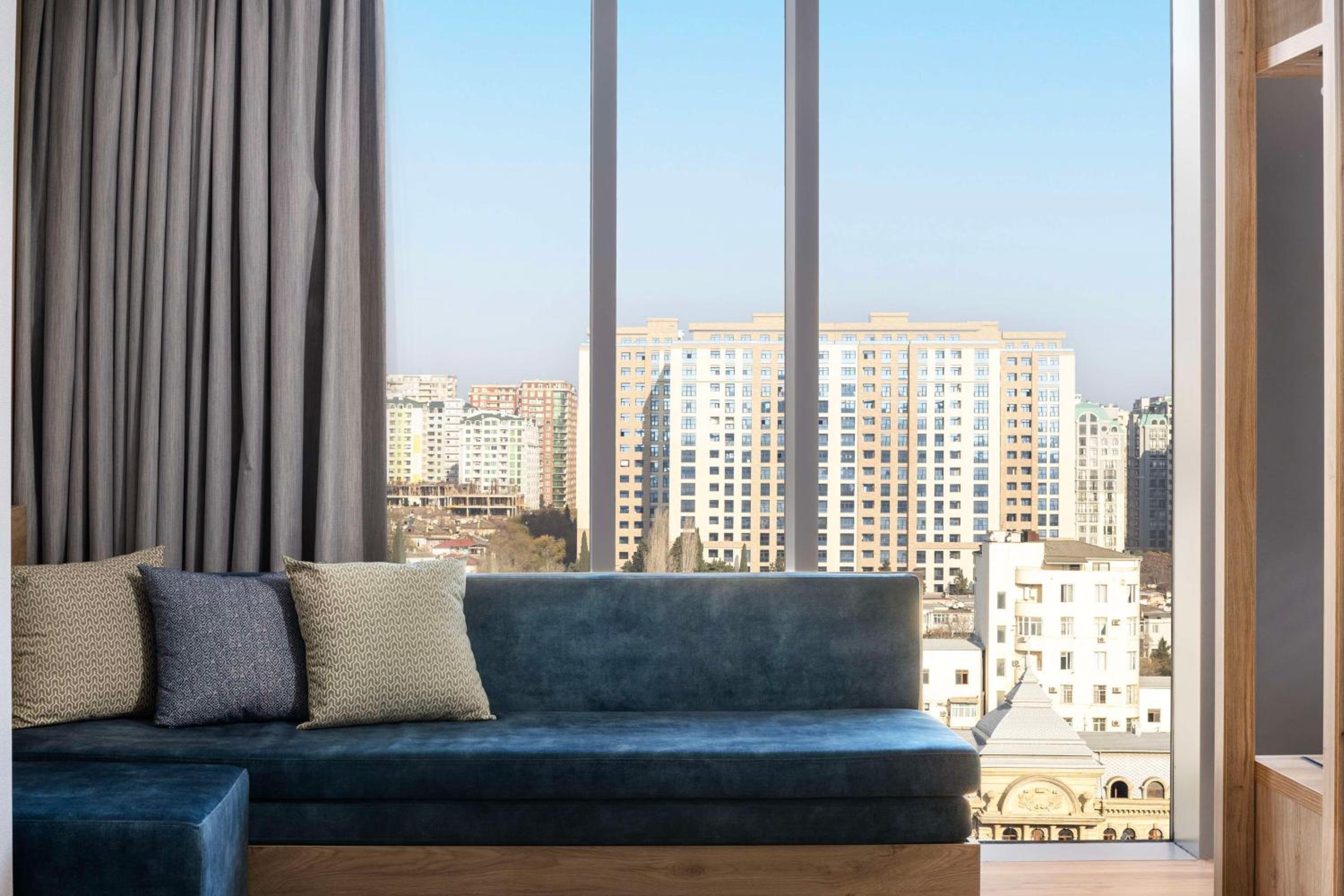 Deluxe King Room with Sofa Bed and City View - High Floor