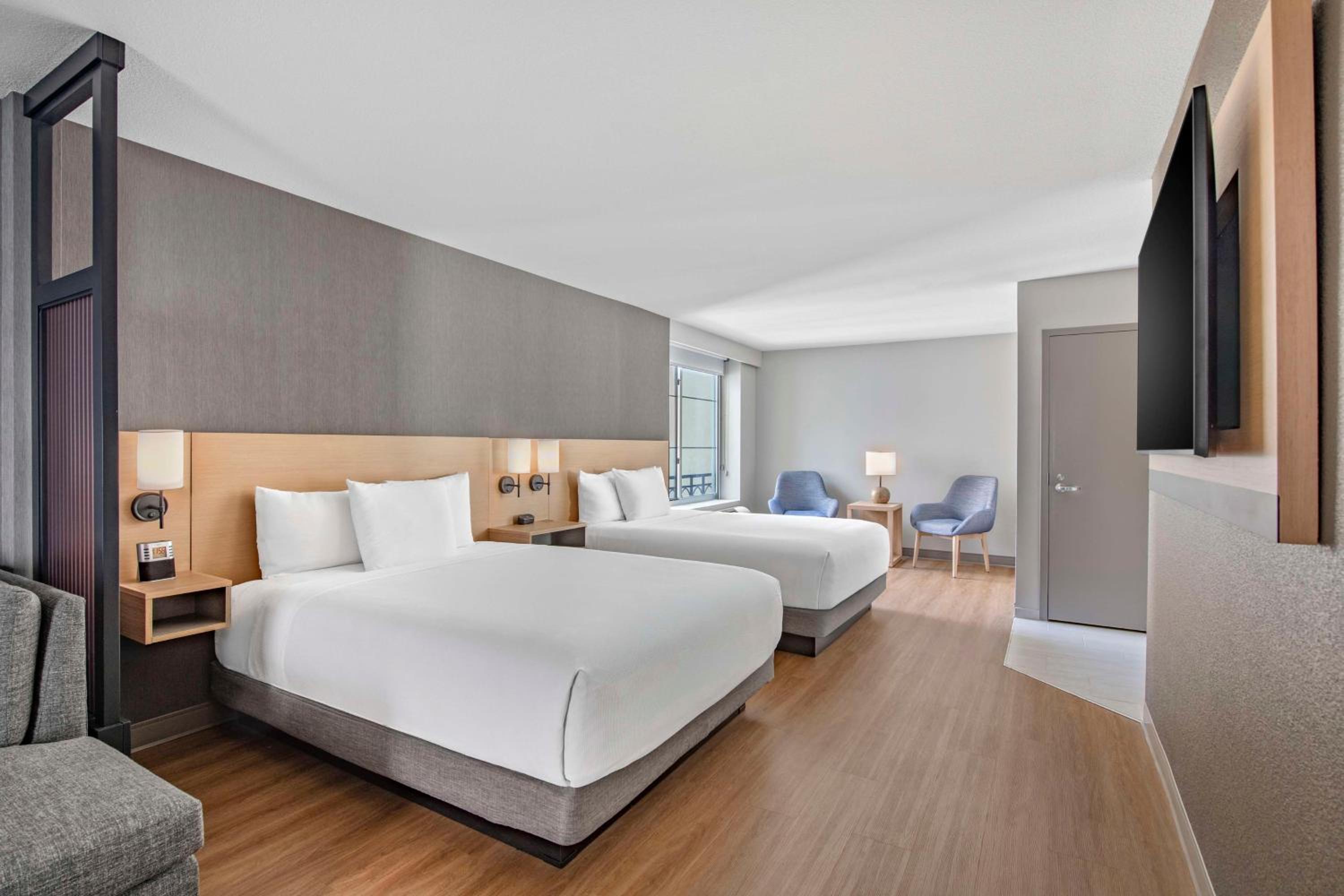 Corner Specialty Room with Two Queen Beds and Sofa Bed - Photo 1