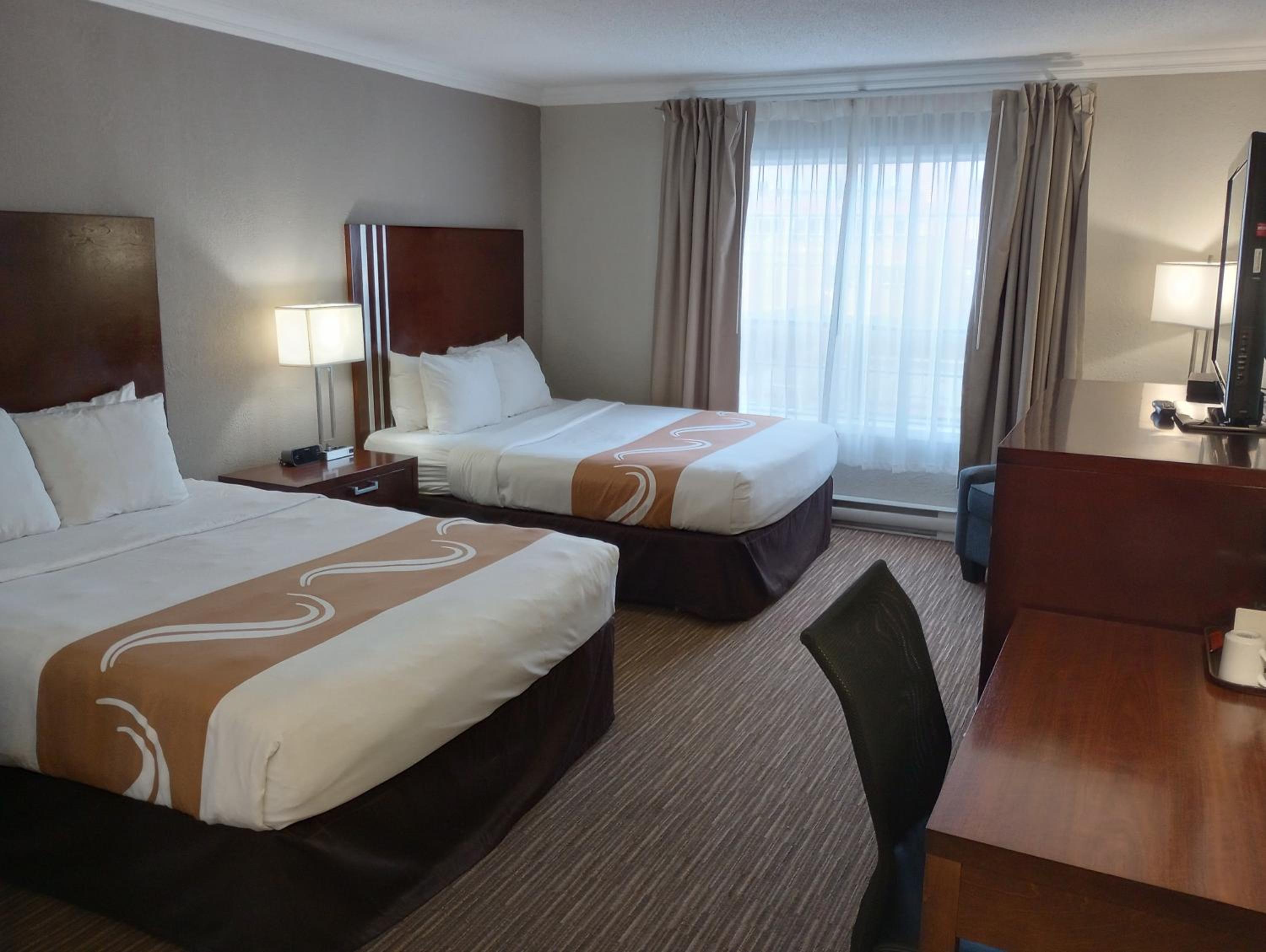 Superior Efficiency Queen Room with Two Queen Beds - Non-Smoking - Photo 1