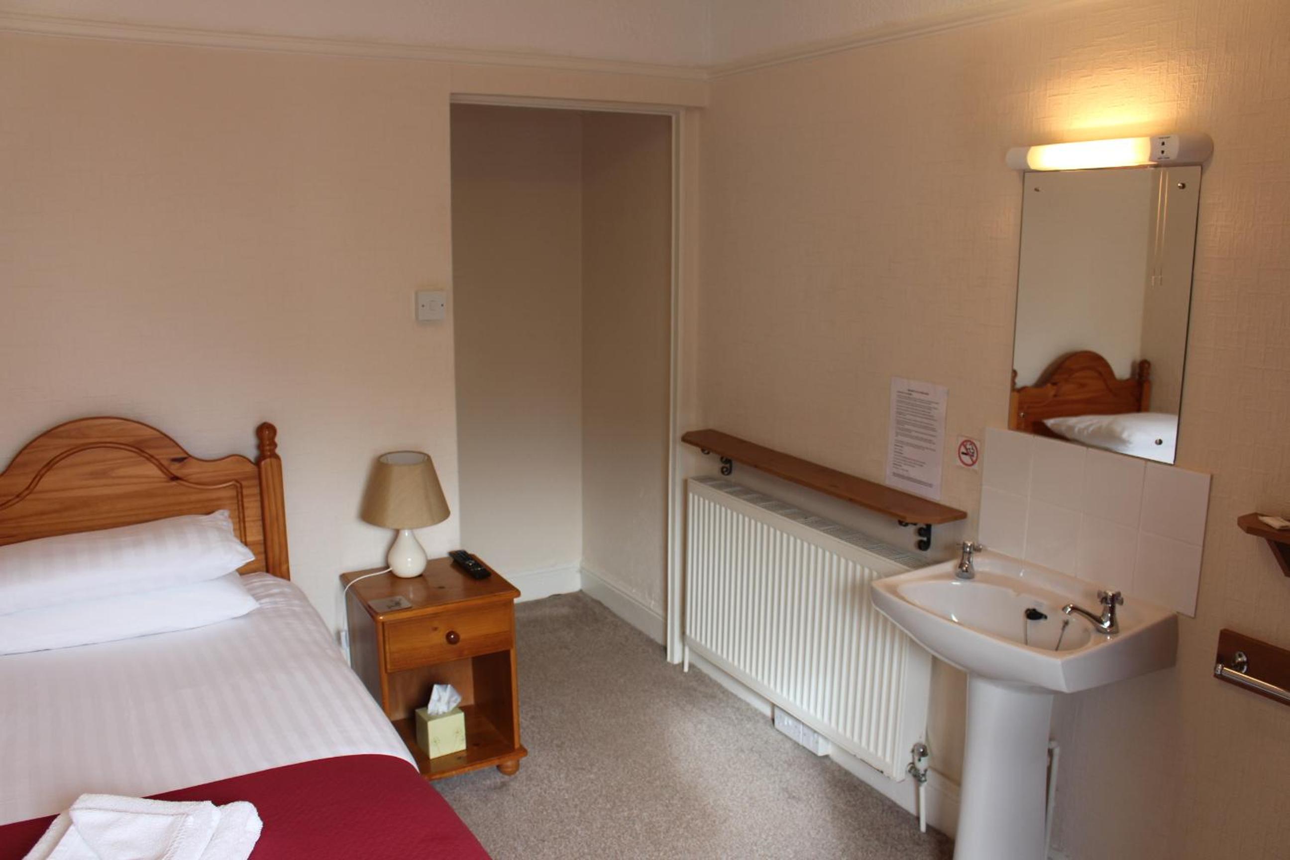 Basic Single Room with Shared Shower and Toilet