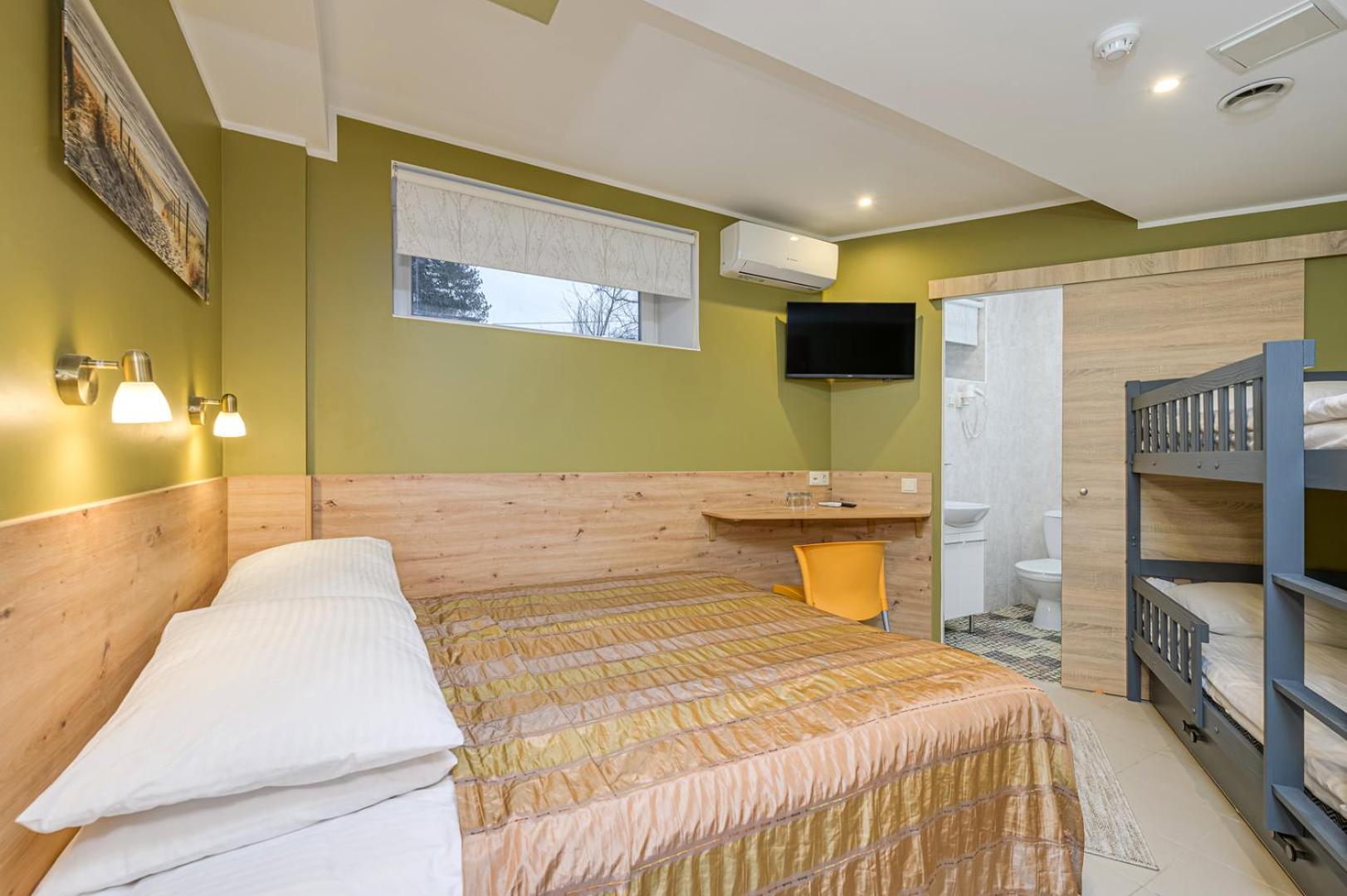 Economy Family Room with Pool and Sauna Access - Semi-basement floor