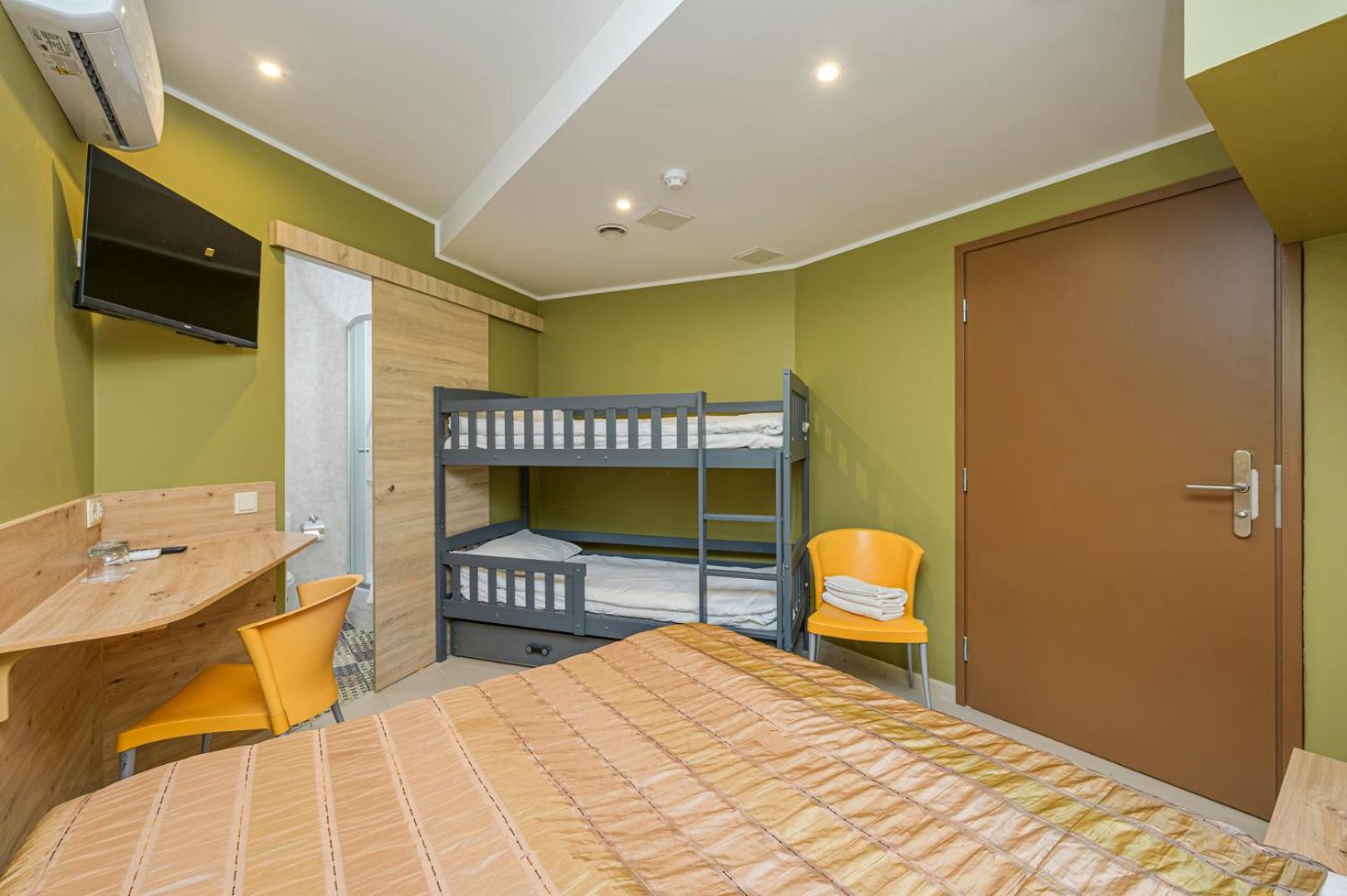 Economy Family Room with Pool and Sauna Access - Semi-basement floor