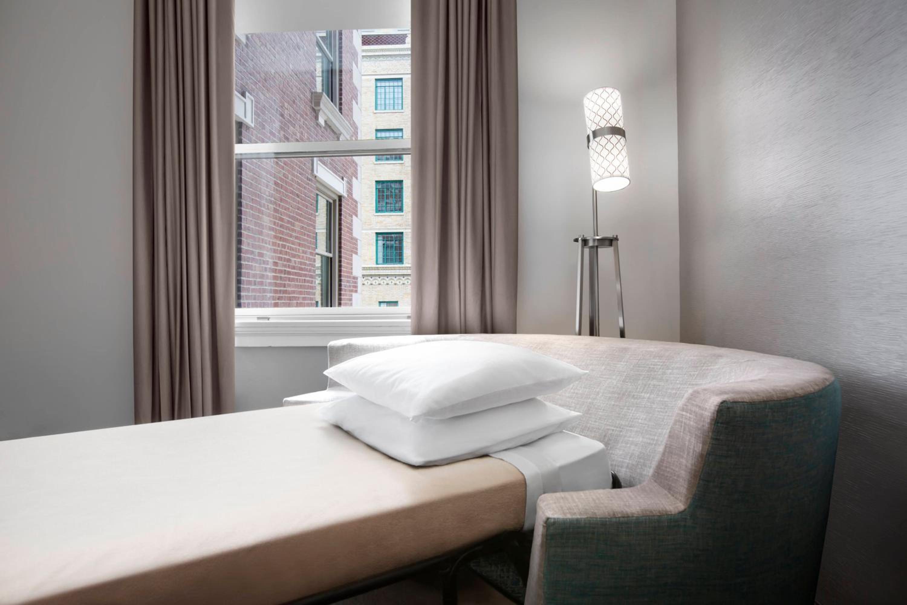 King Suite with Roll-In Shower and Sofa Bed - Mobility Access/Hearing Accessible at Courtyard by Marriott Cape Girardeau Downtown in Cape Girardeau