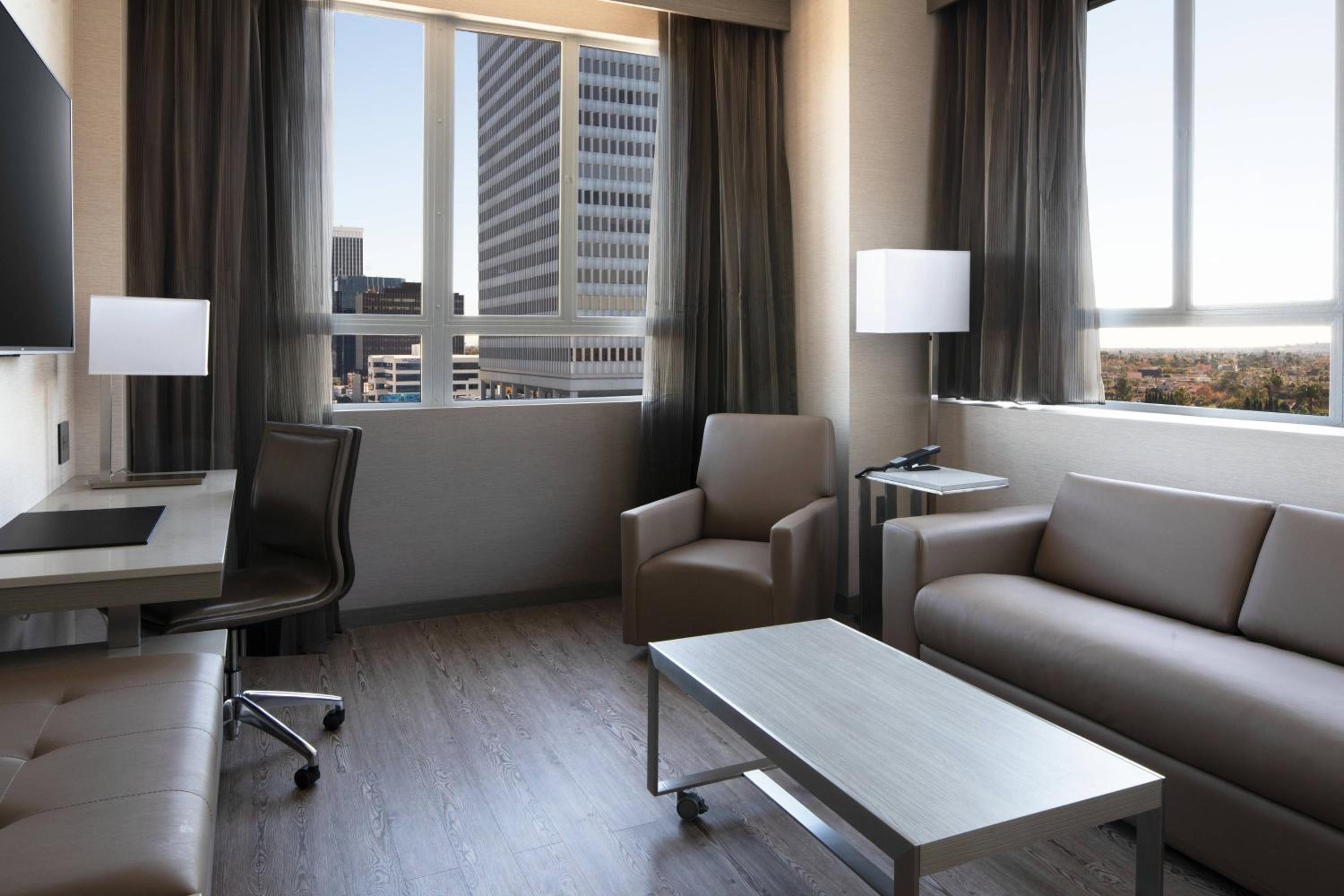 One-Bedroom King Suite with Sofa Bed and City View - Mobility Accessible with Roll-in Shower