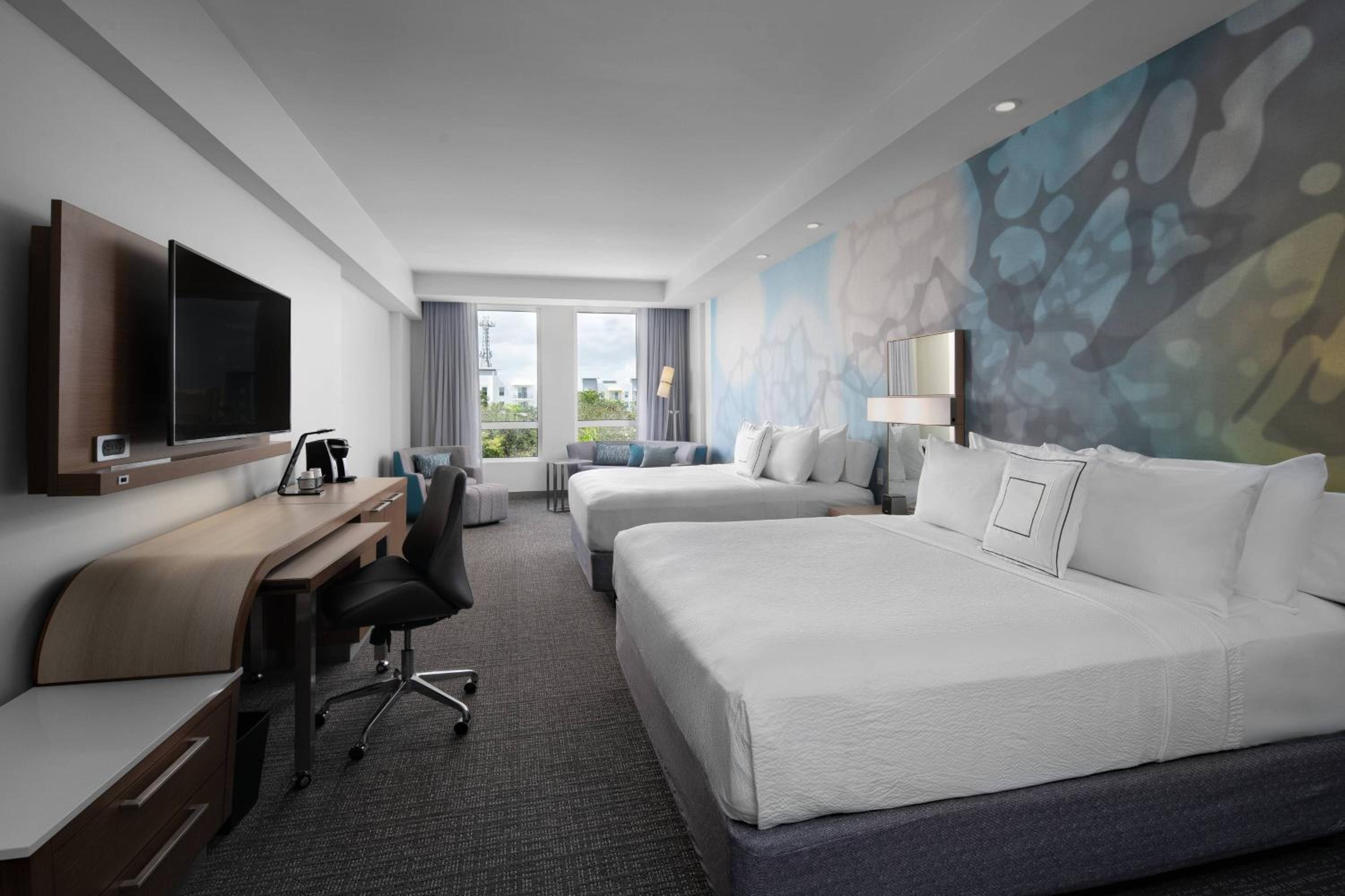 Room with Two King Beds and Sofa Bed - Photo 1