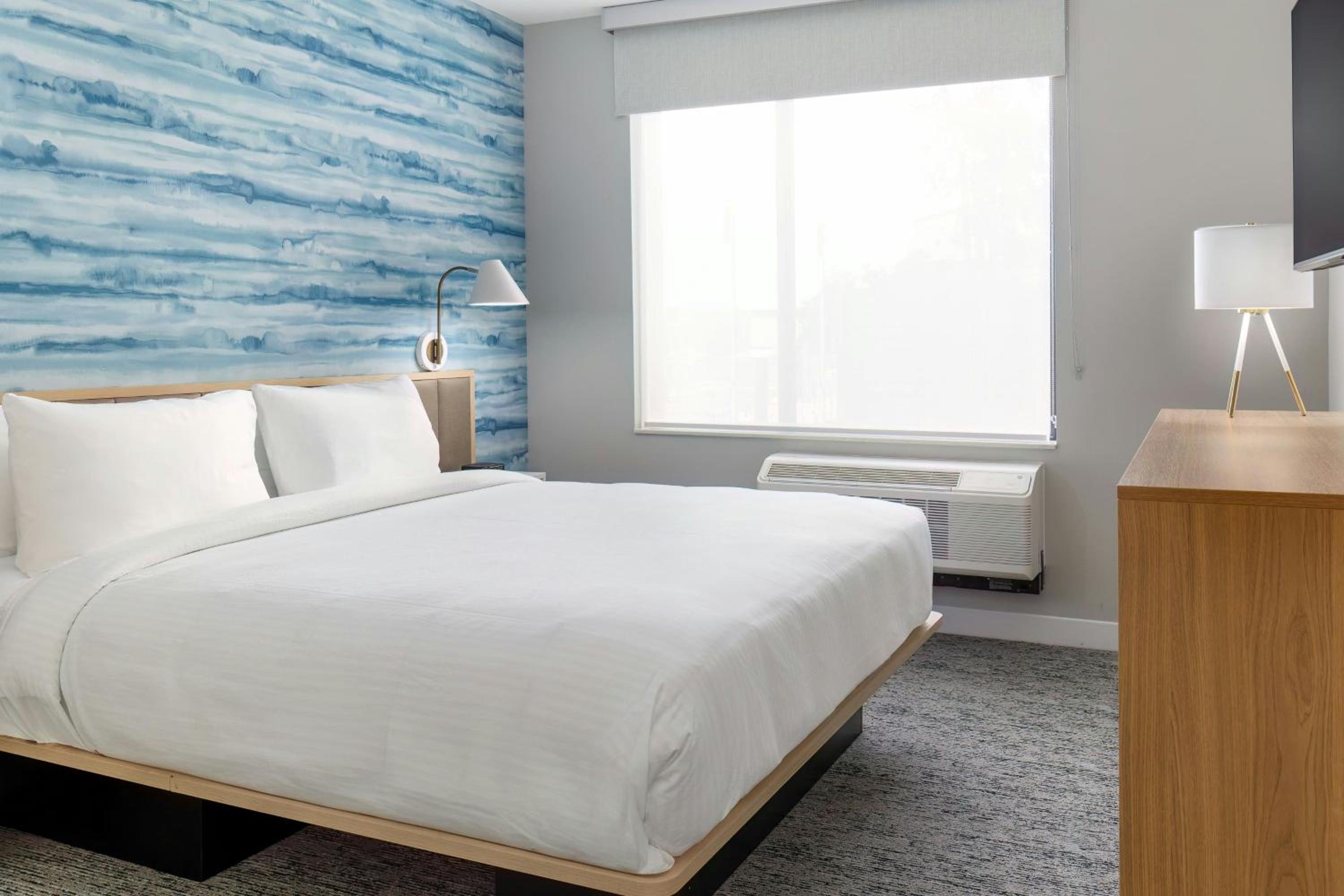 One-Bedroom Corner King Suite with Sofa Bed - Hearing Accessible photo 1