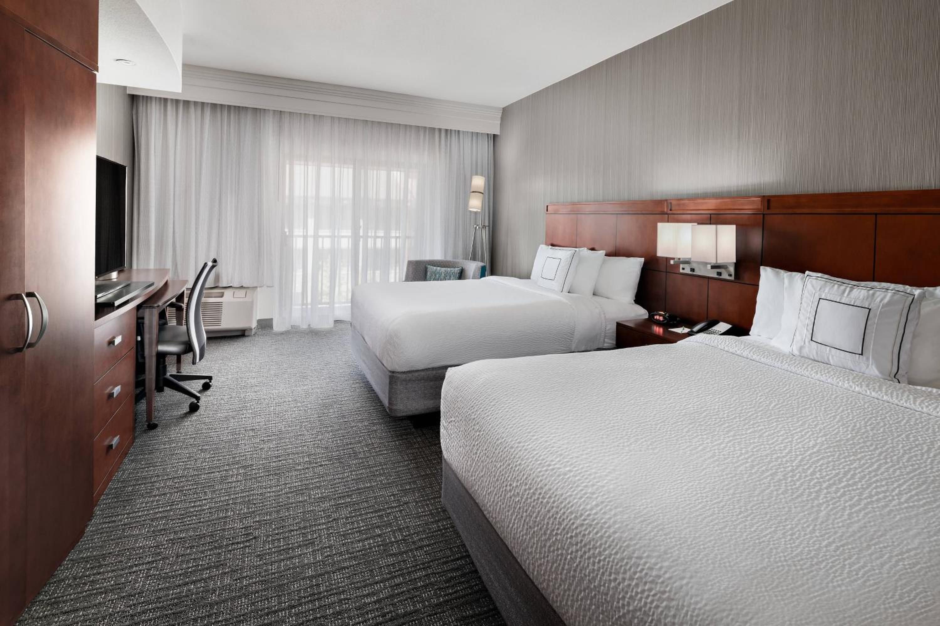 Queen Room with Two Queen Beds and Balcony - Hearing Accessible photo 1