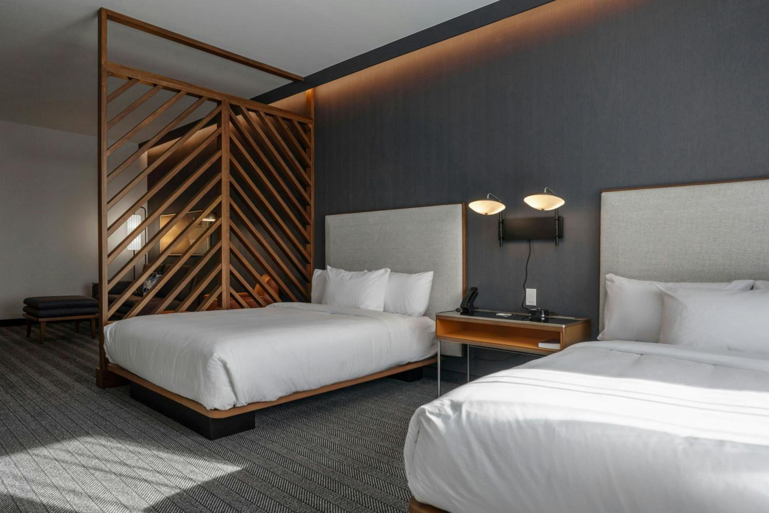 Queen Suite with Two Queen Beds and Sofa Bed - Photo 1
