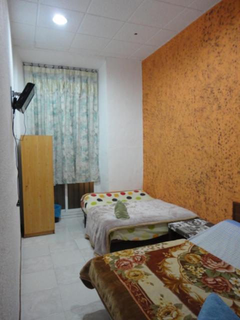 Habitación Cuádruple con Baño Compartido