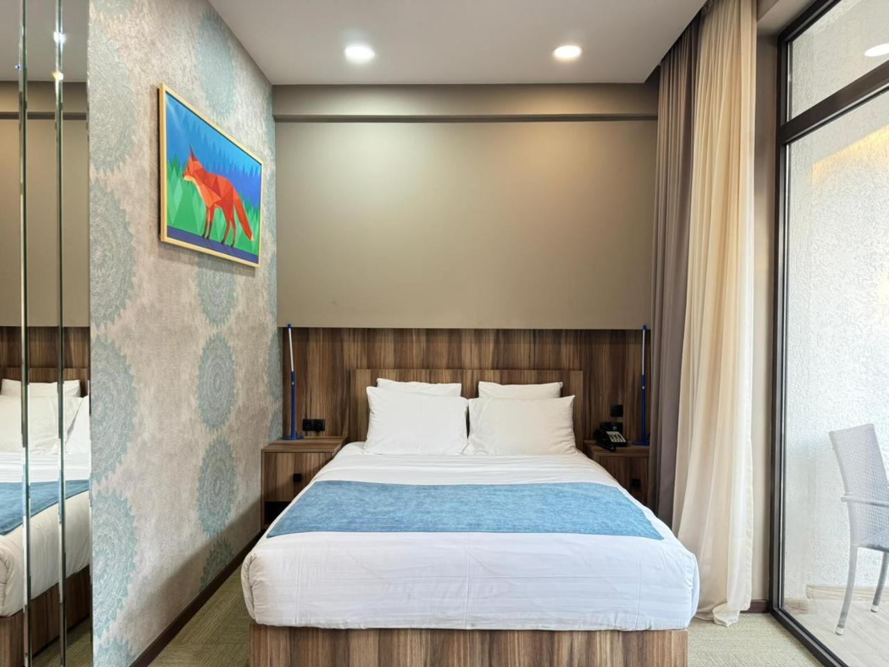 Economy Queen Room with Balcony and Garden View - Non-Smoking, photo 6