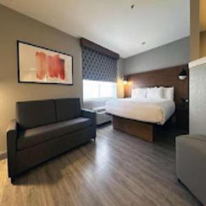 Suite with One Queen Bed and Full Kitchen - Non-Smoking - Photo 1