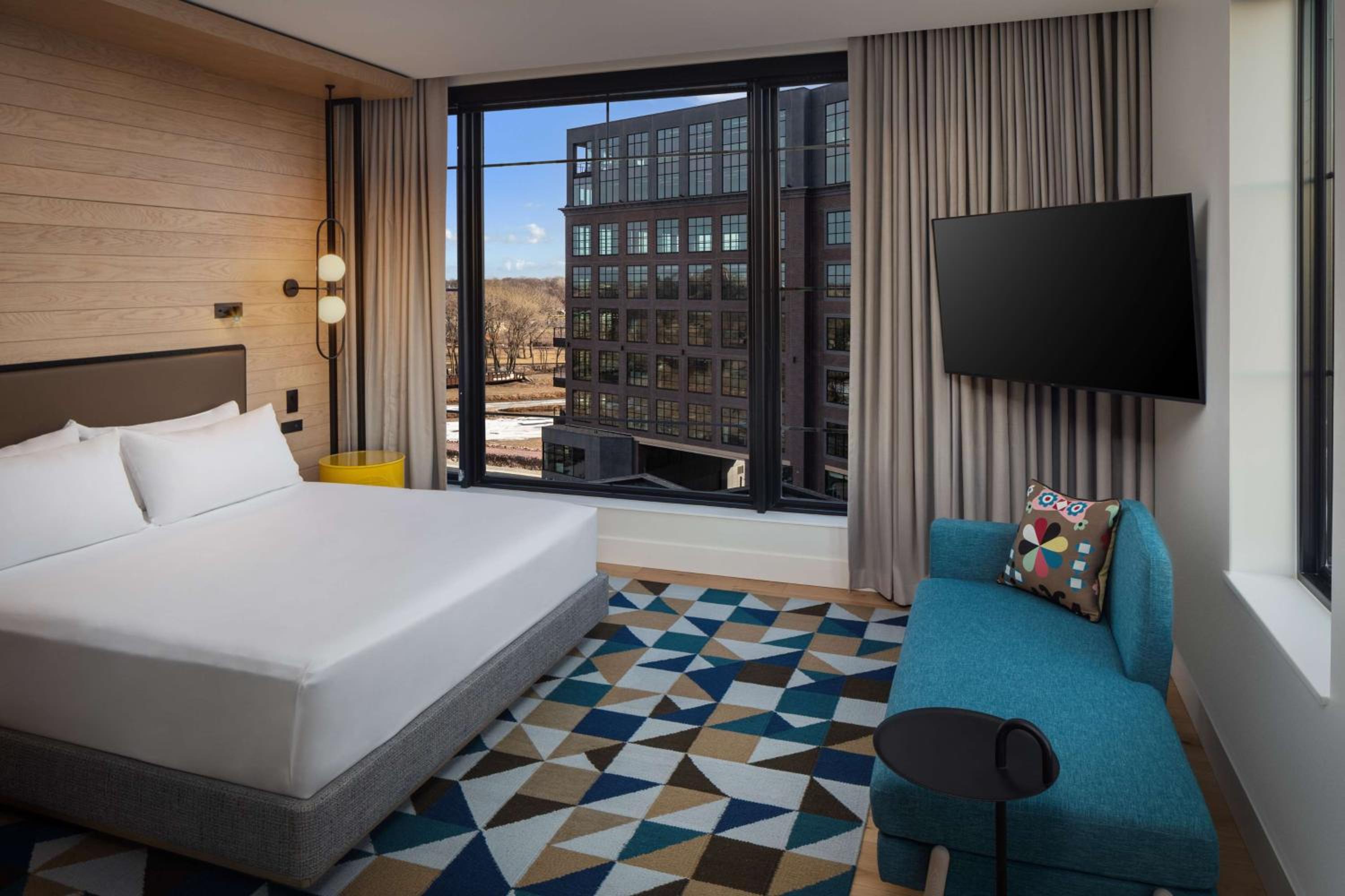 Corner King Room with Balcony and Steel District View - Photo 1