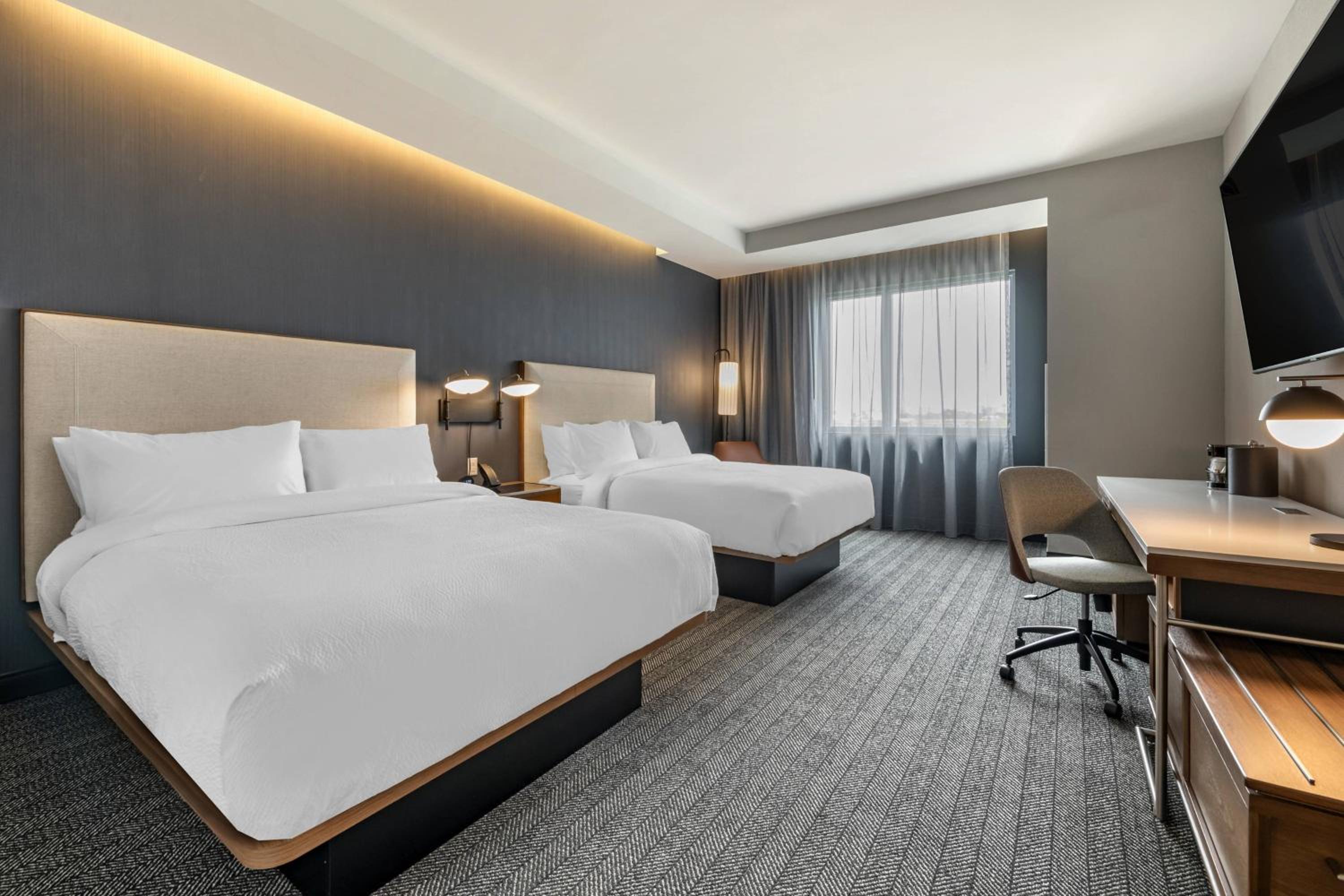 Queen Room with Two Queen Beds - Mobility and Hearing Accessible with Tub - Photo 1