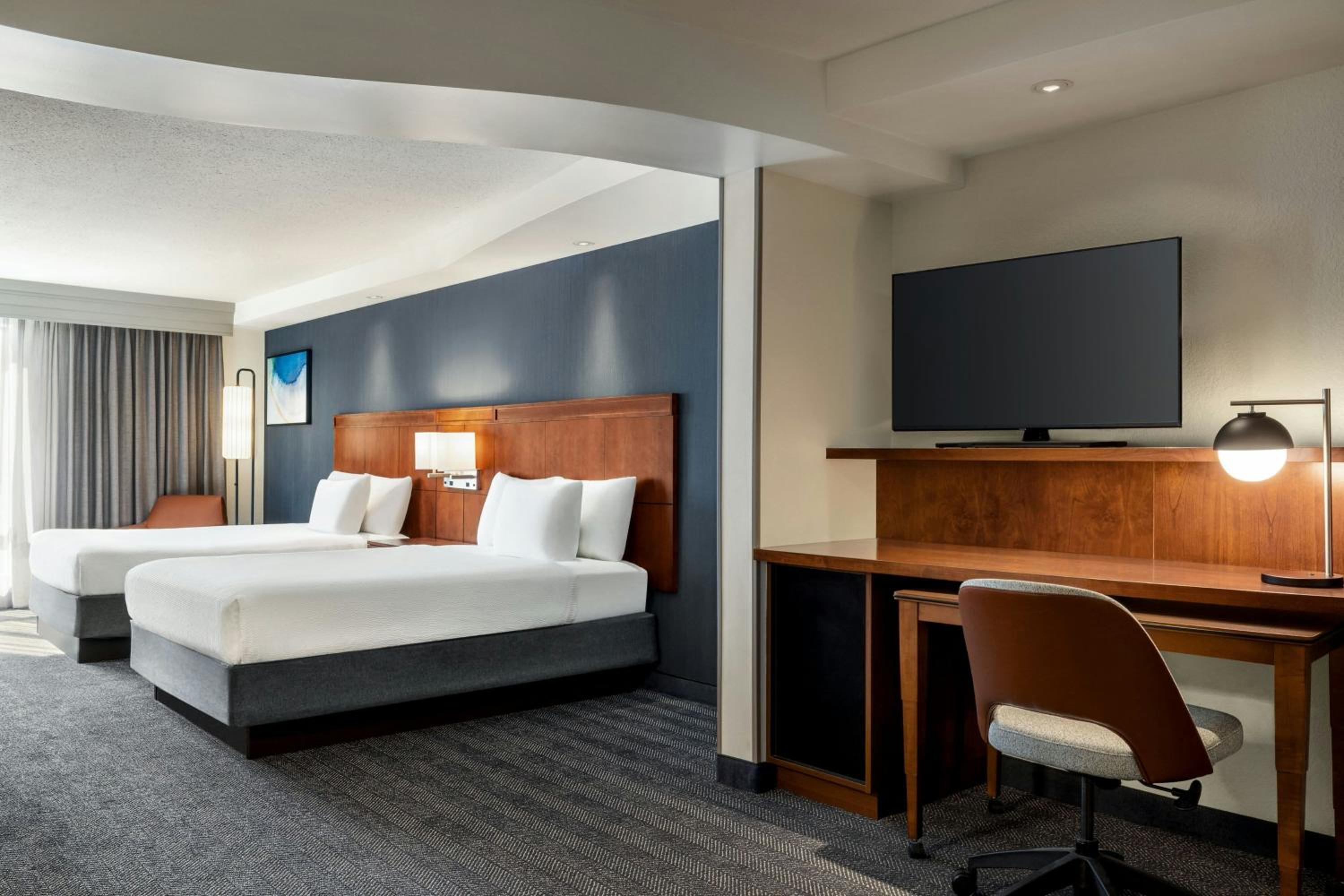 Queen Suite with Two Queen Beds and Sofa Bed - Photo 1