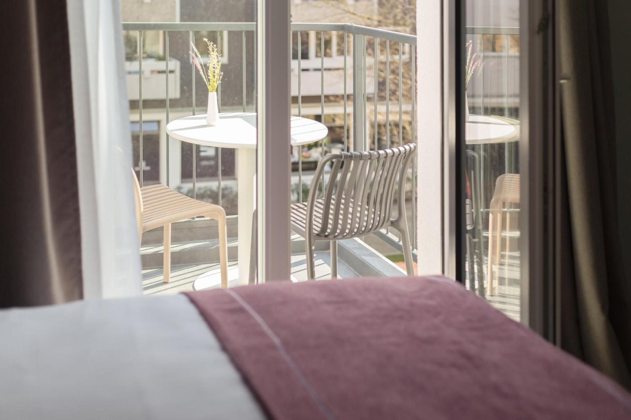 Standard Queen Room with Balcony - Up to Three Adults