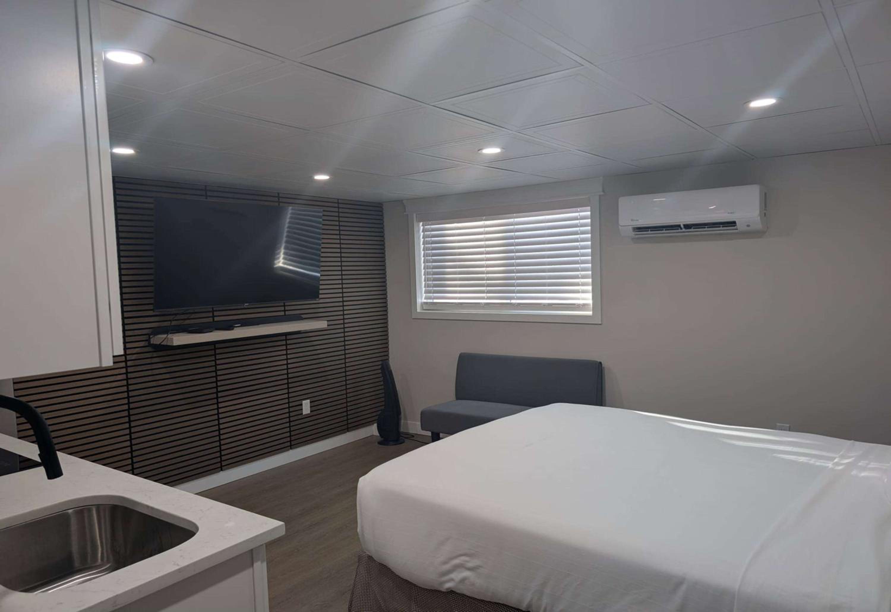 Suite with One Queen Bed and Kitchenette - Roll-In Shower - Non-Smoking - Photo 1