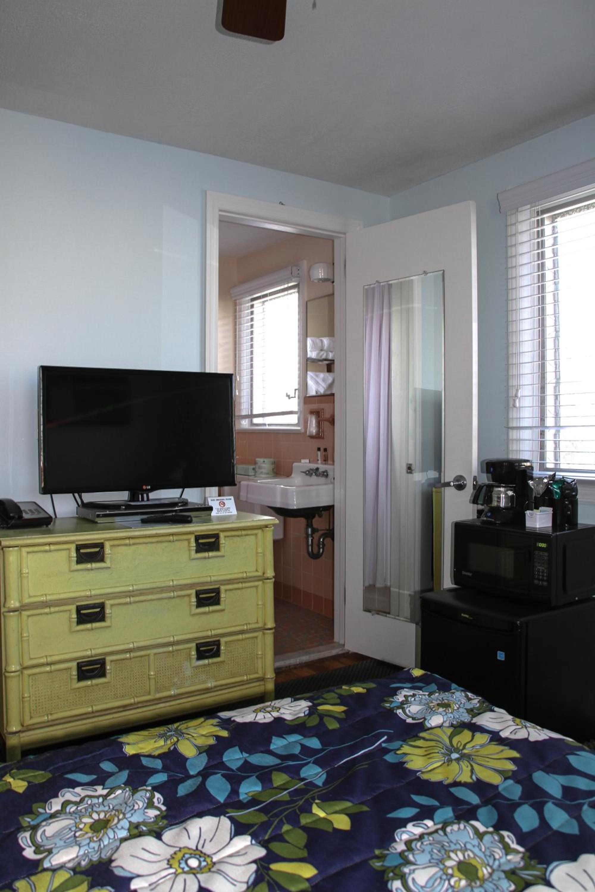 Petite Room with One Queen Bed- In Separate House photo 3