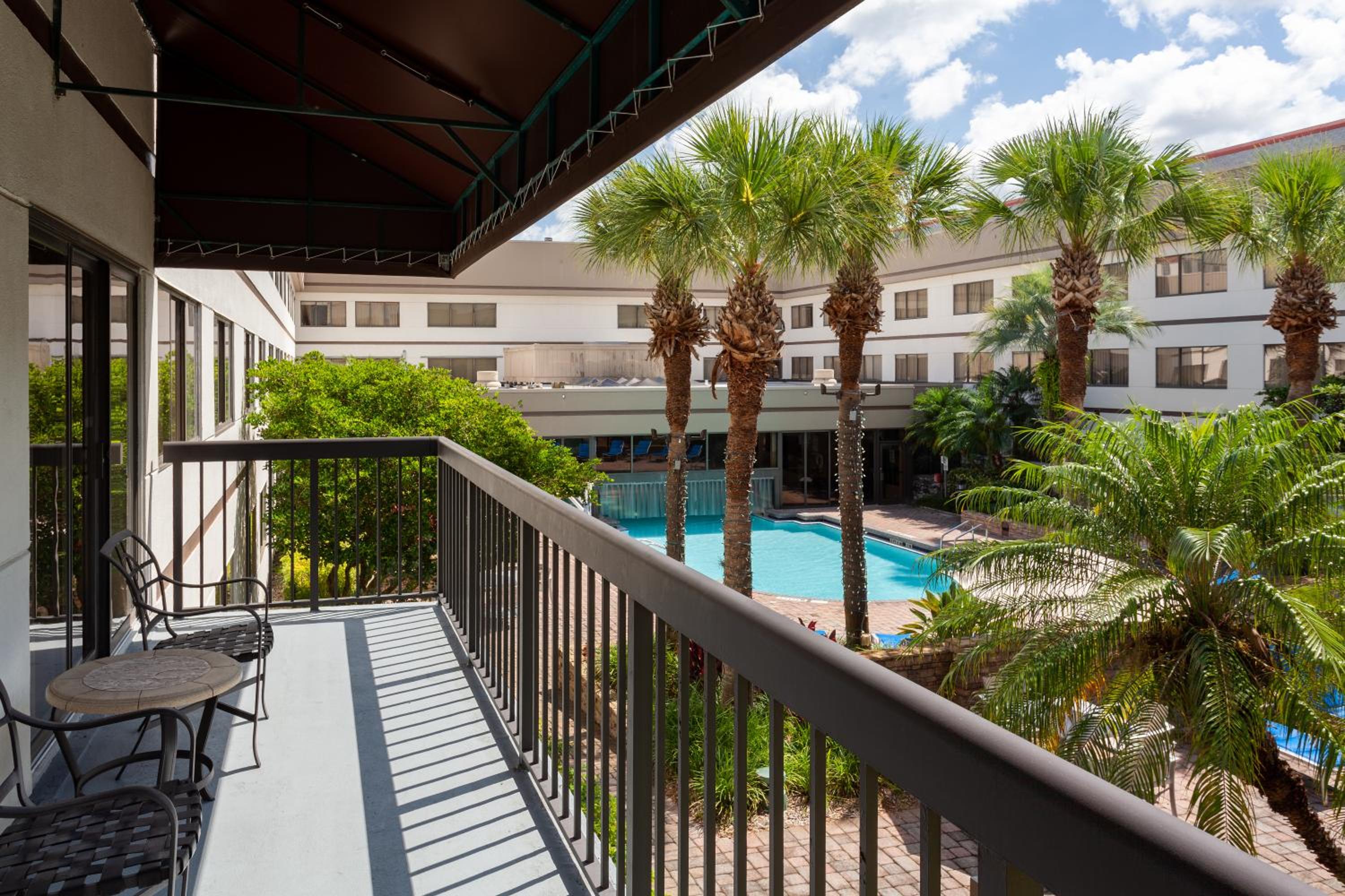 One-Bedroom Suite with Balcony and Pool View