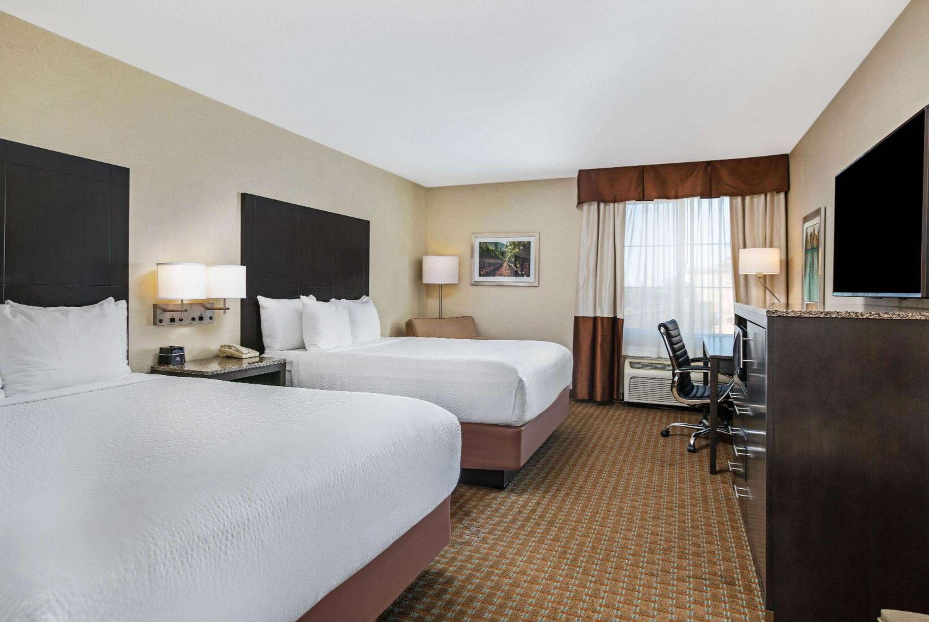 Deluxe Queen Room with Two Queen Beds - Photo 1
