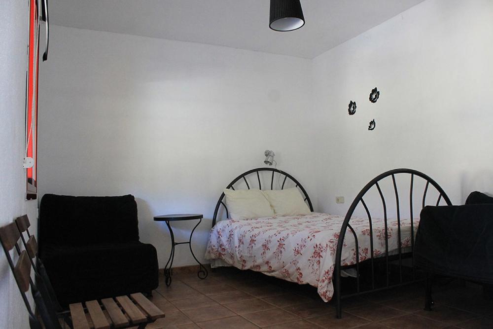 Habitación Cuádruple con Vista al Jardín
