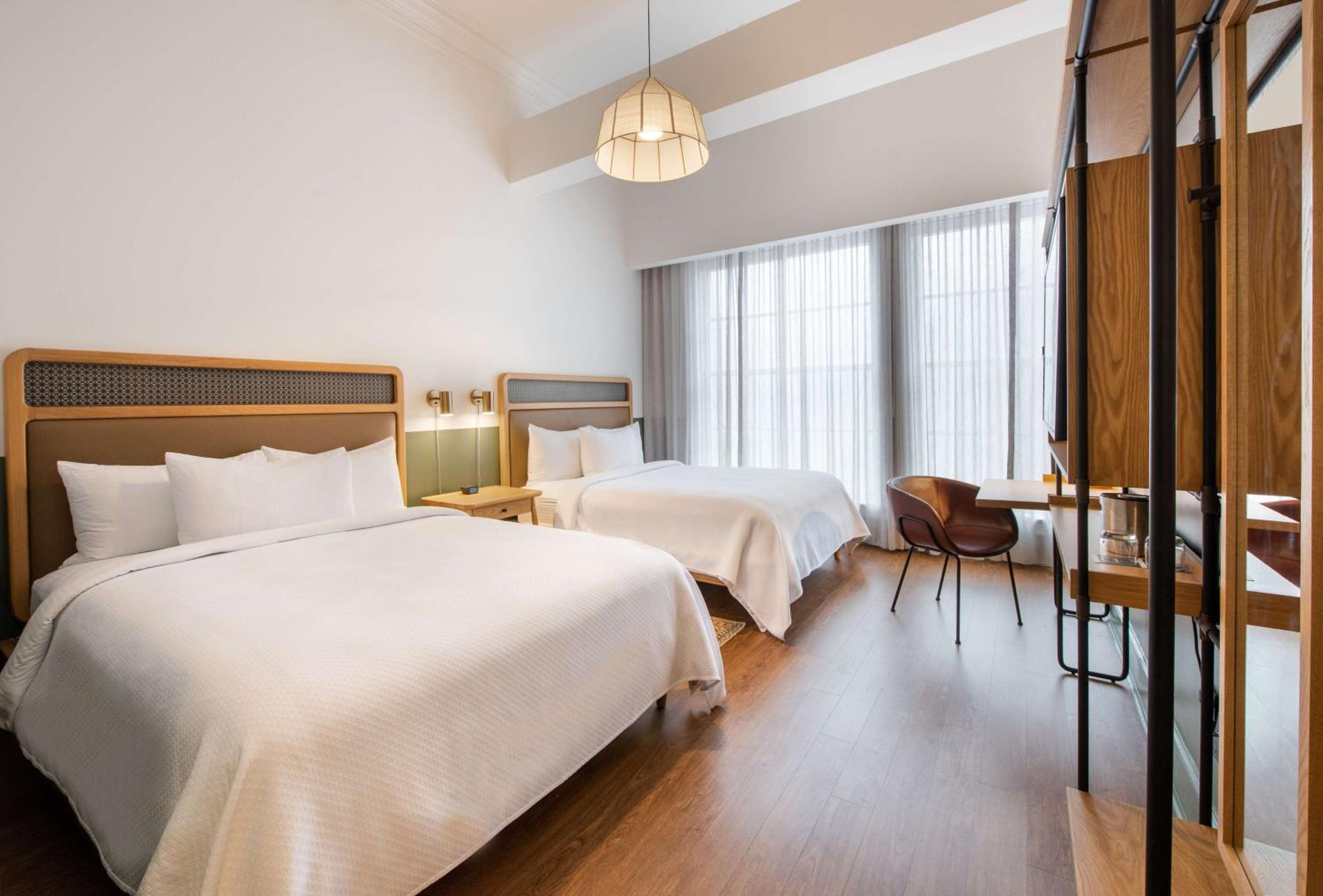 Queen Room with Two Queen Beds - Photo 1