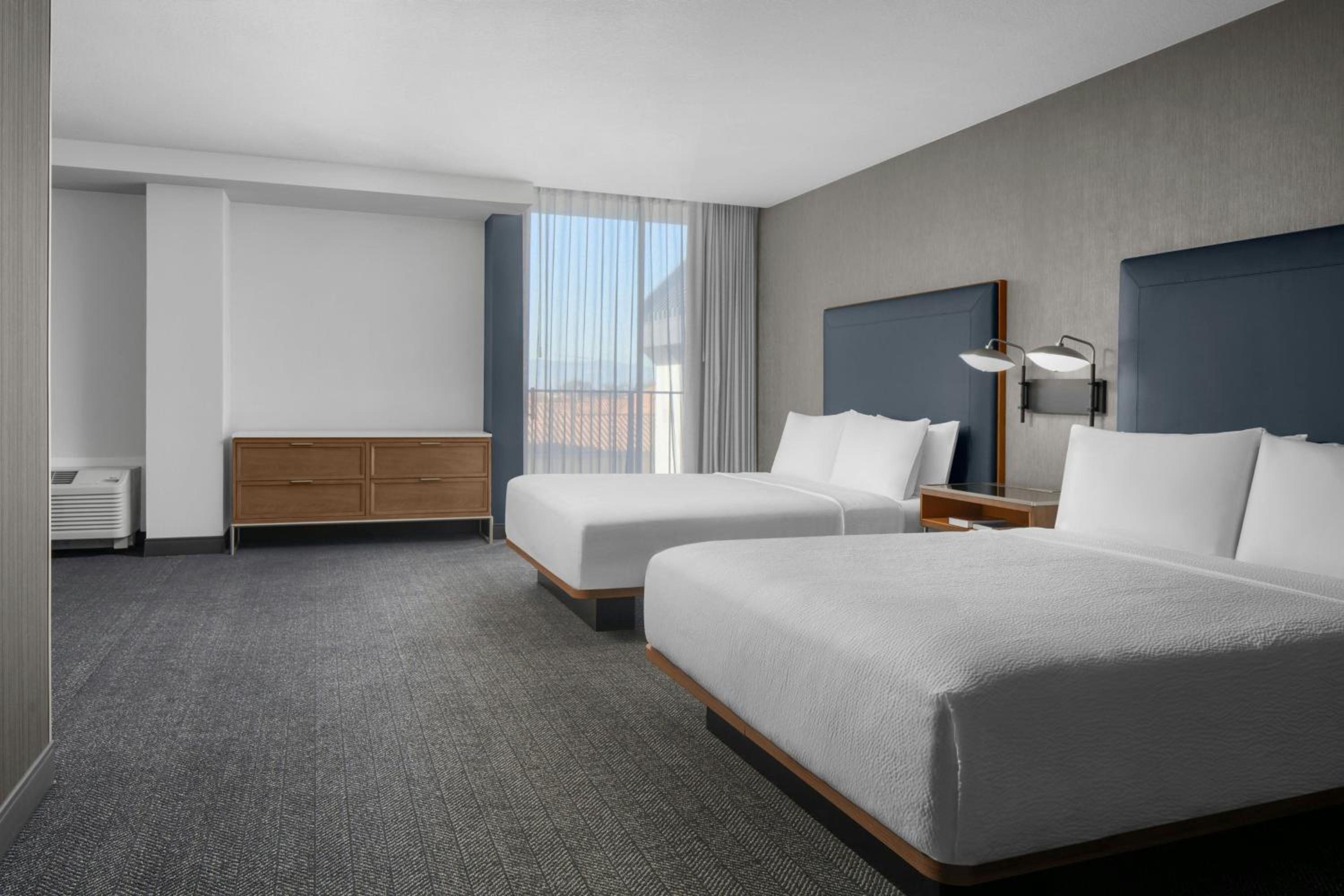 One-Bedroom Queen Suite with Two Queen Beds and Roll-In Shower - Mobility Access photo 1