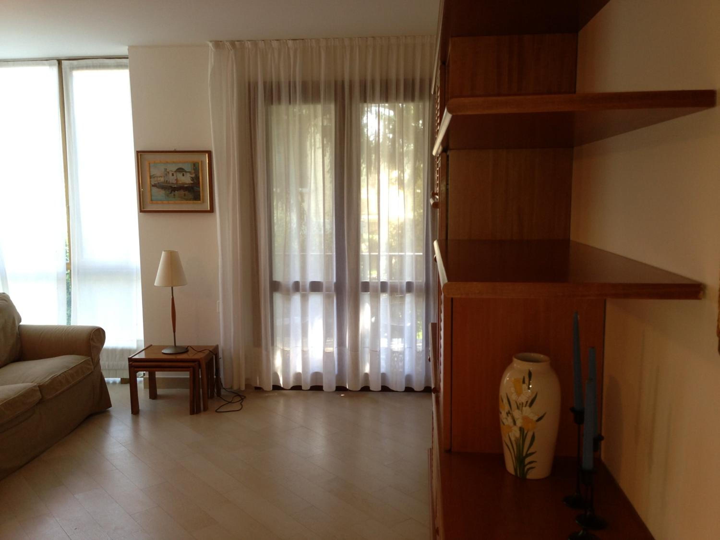 One-Bedroom Apartment with Balcony and Partial Lake View photo 1