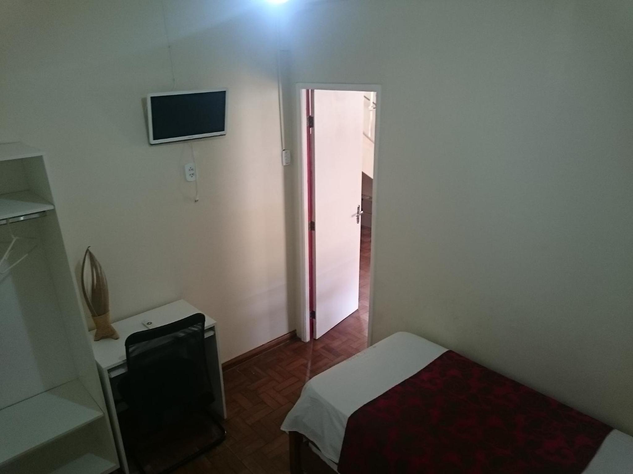 Room with pull out bed and a fan photo 2
