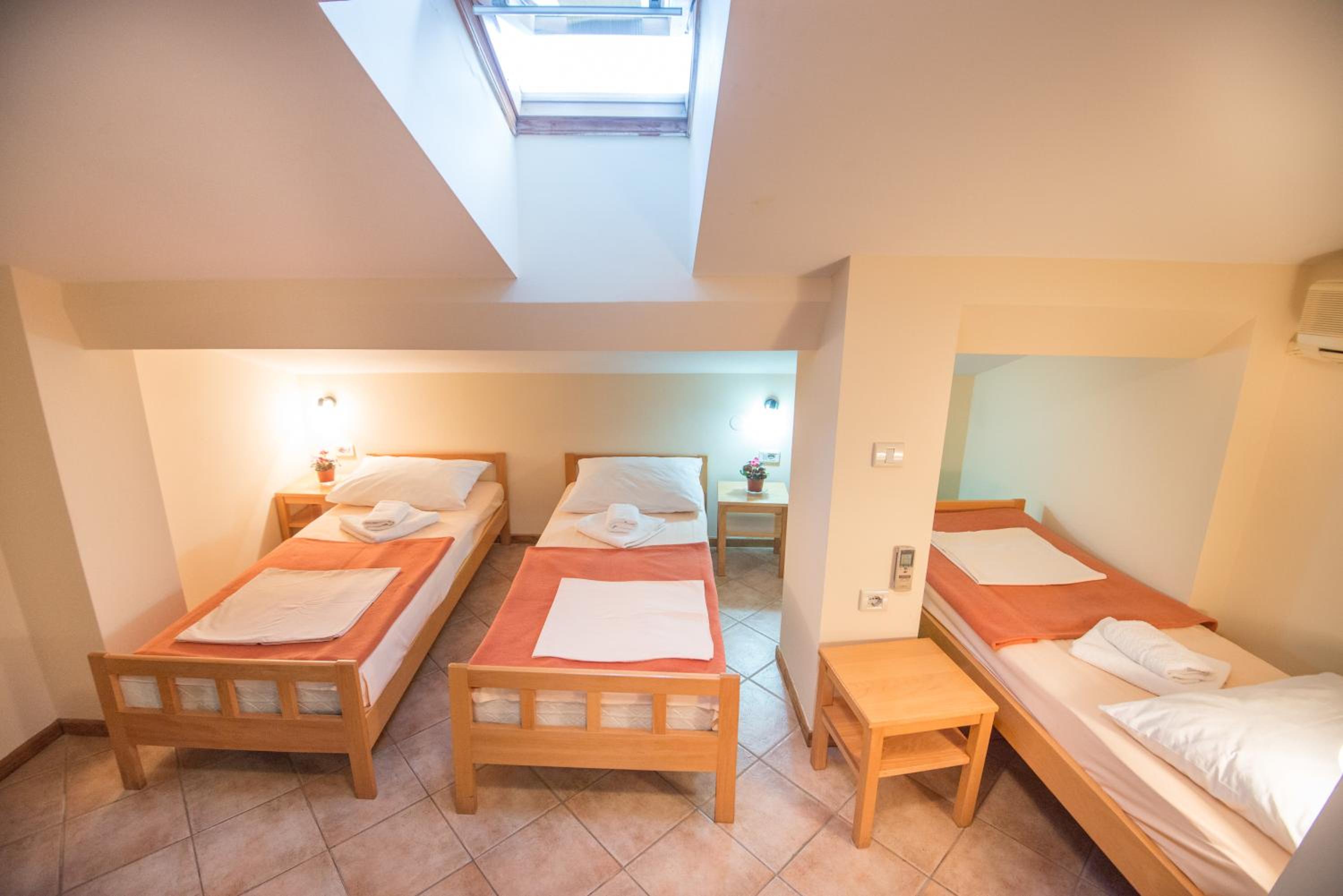 Triple Room with Rooftop Window (4th floor) photo 1