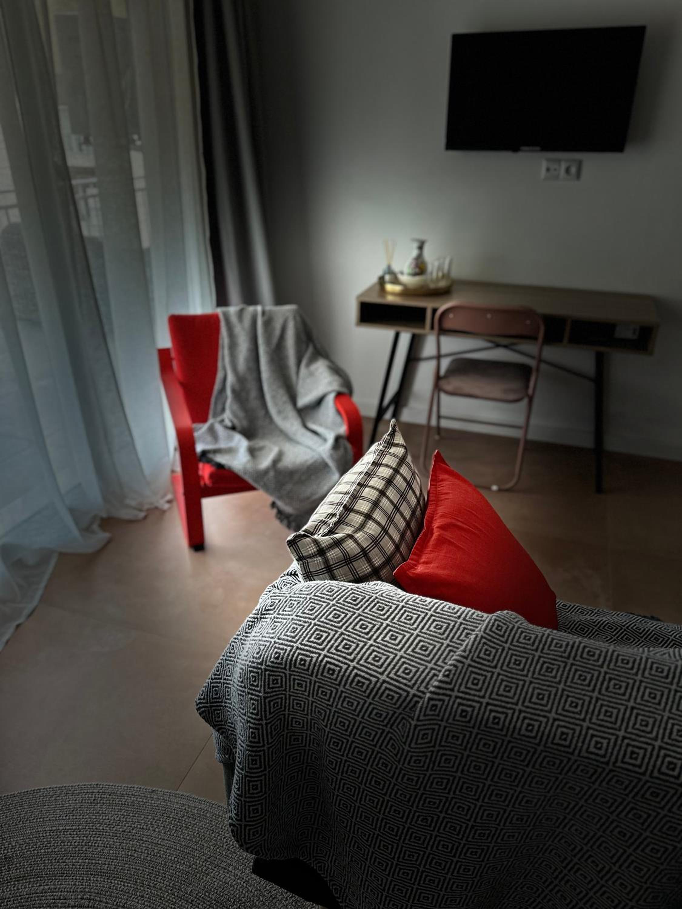 One-Bedroom Apartment with Balcony and City View