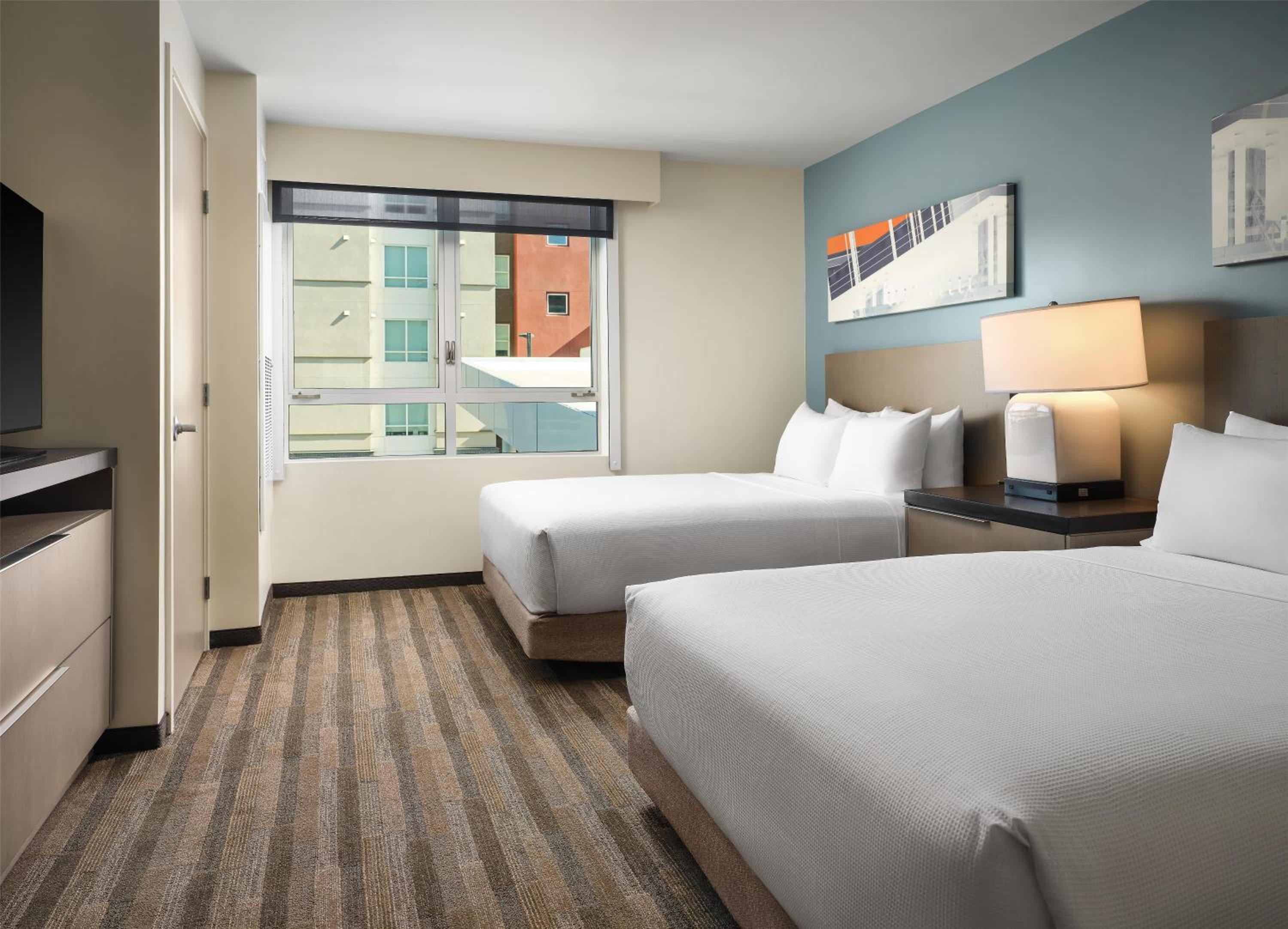 One-Bedroom Specialty Suite with Two Queen Beds, Kitchen and Sofa Bed