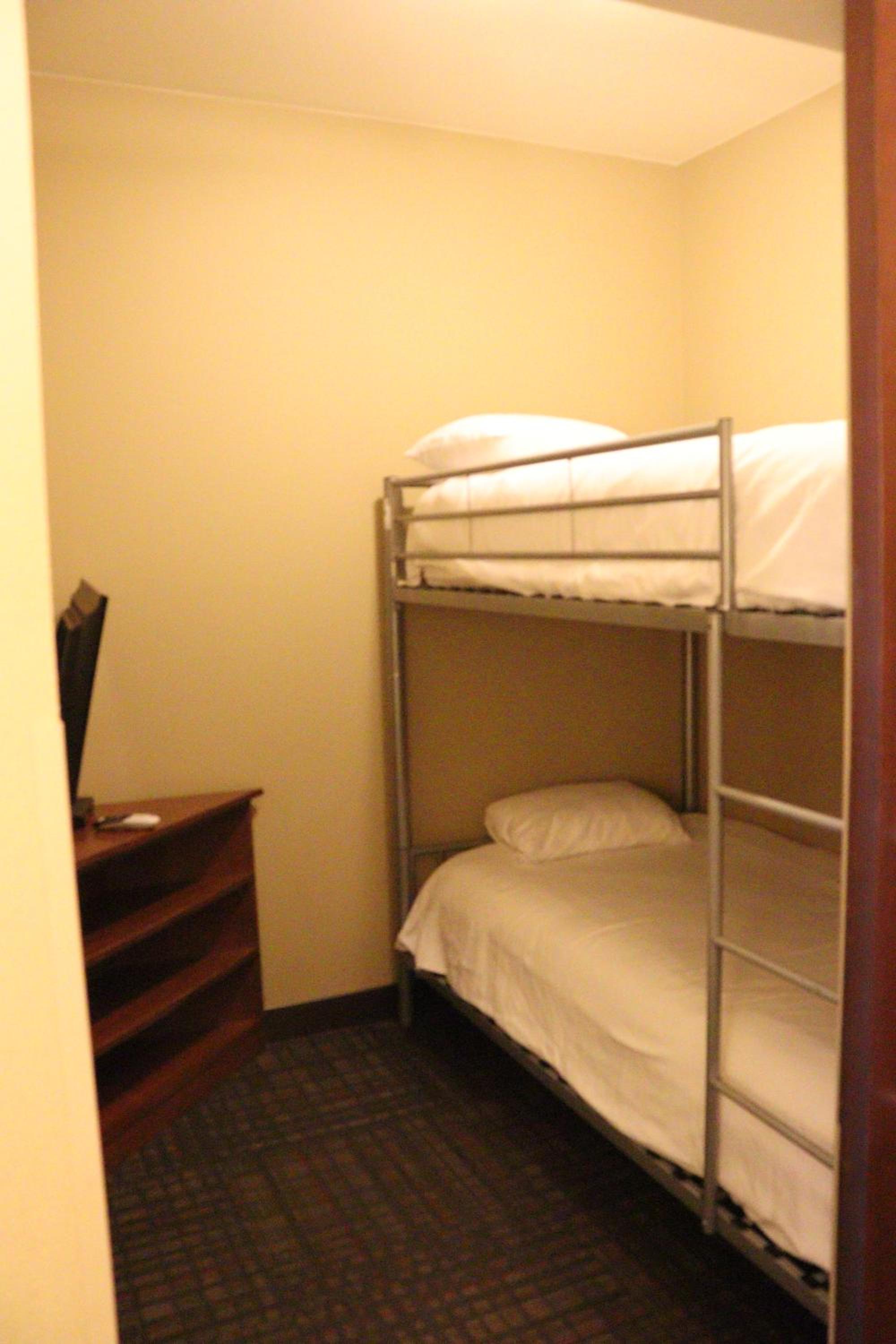 Suite with One King Bed and Two Single Beds - Non-Smoking photo 2