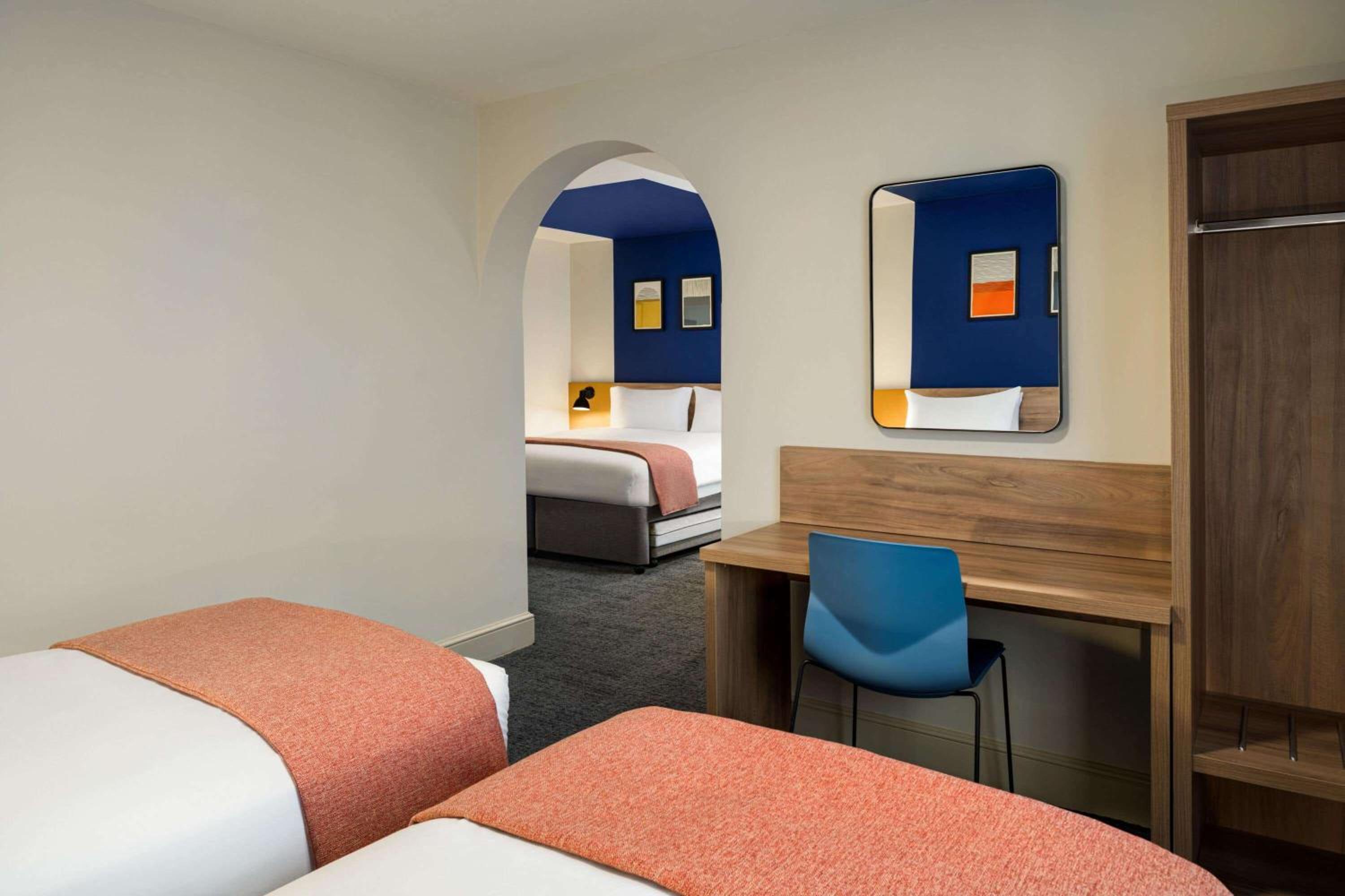Family Room with One King Bed and Two Twin Beds - Photo 3