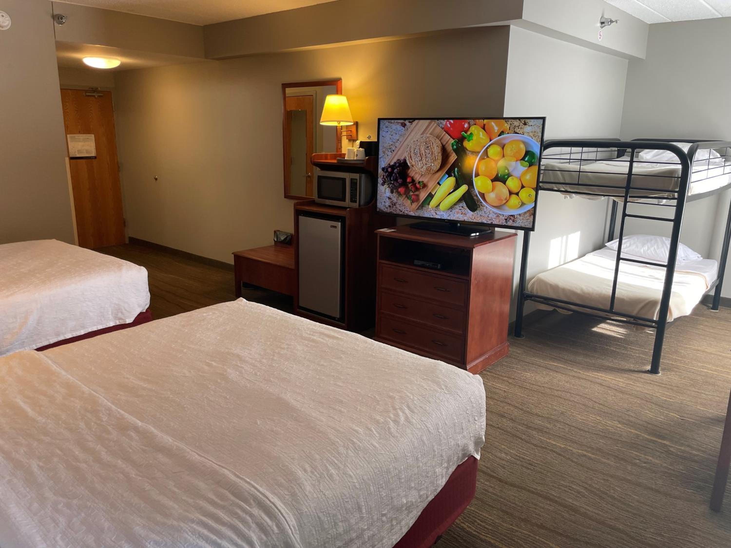 Queen Room with Two Queen Beds and One Twin Bunk Bed - Non-Smoking photo 1