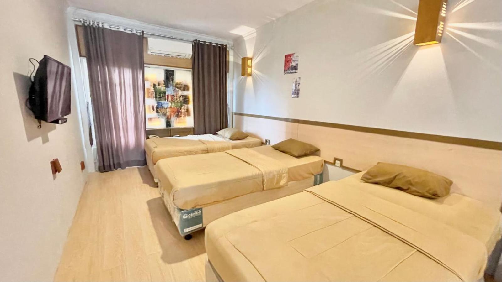 Deluxe Triple Room - Photo 2
