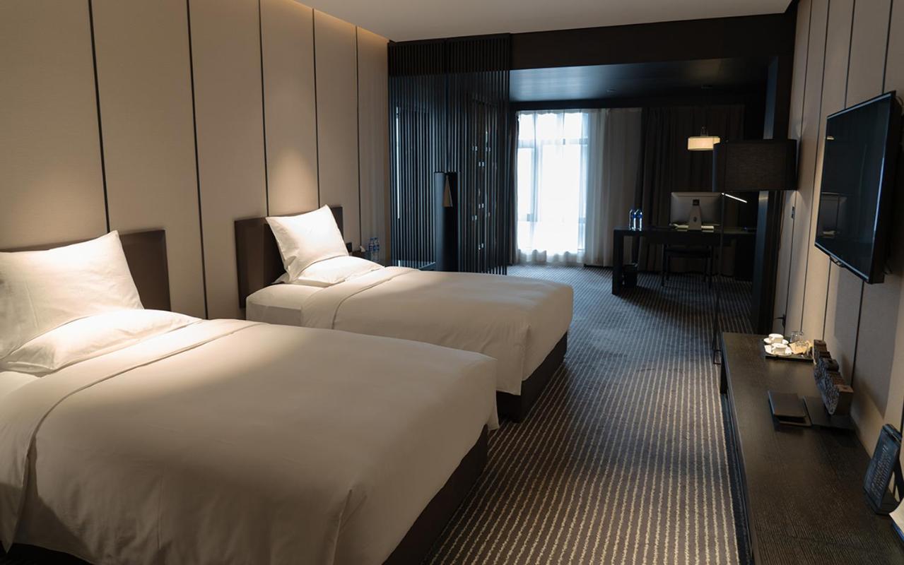 Two-Bedroom Deluxe Suite with One King Bed and Two Double Beds