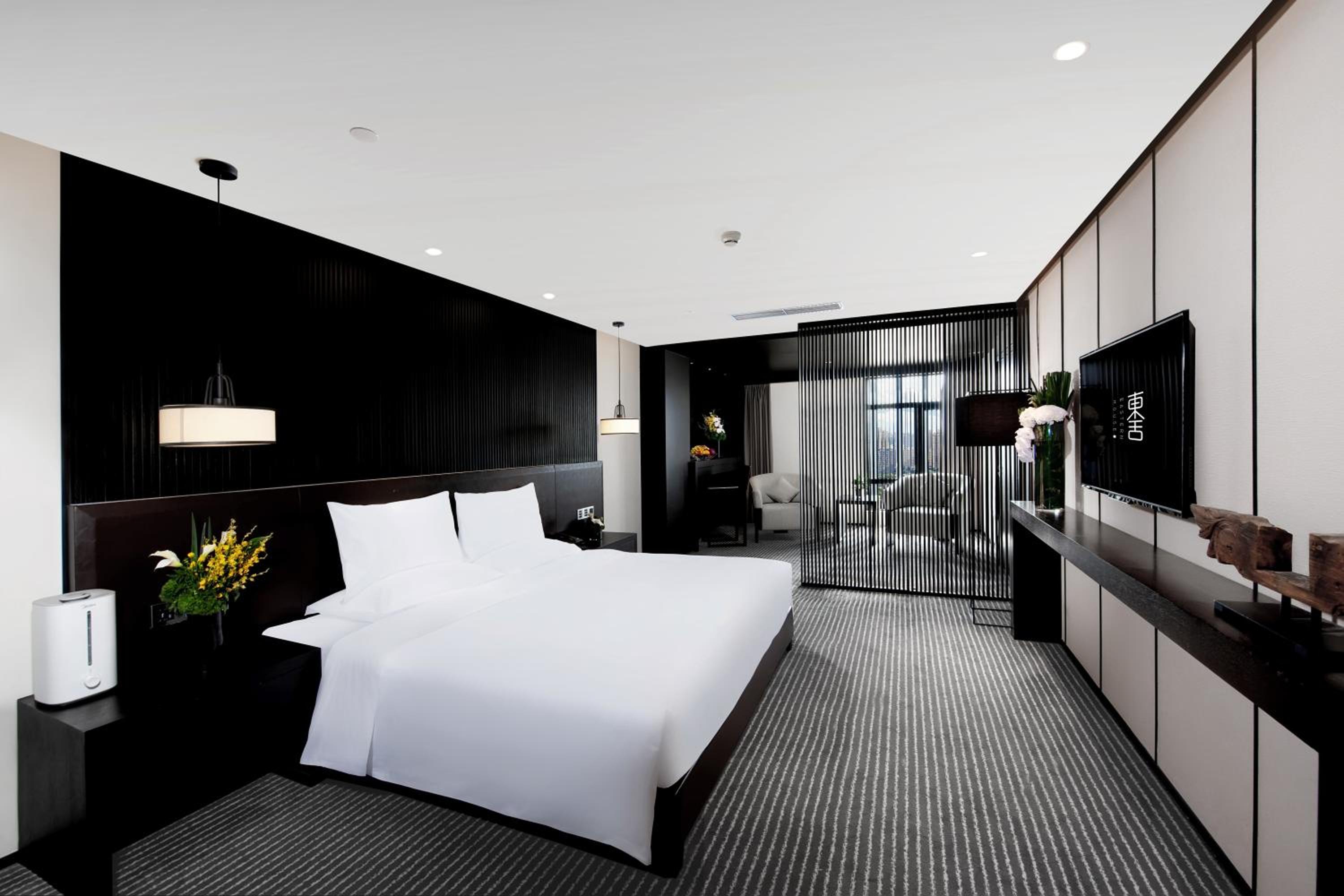 Two-Bedroom Deluxe Suite with One King Bed and Two Double Beds