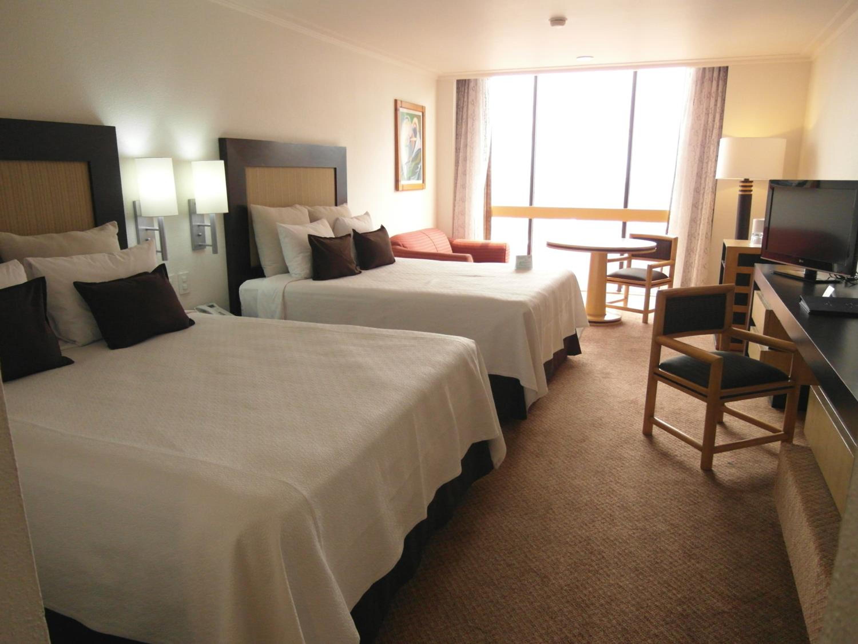 Standard Queen Room with Two Queen Beds - Photo 1