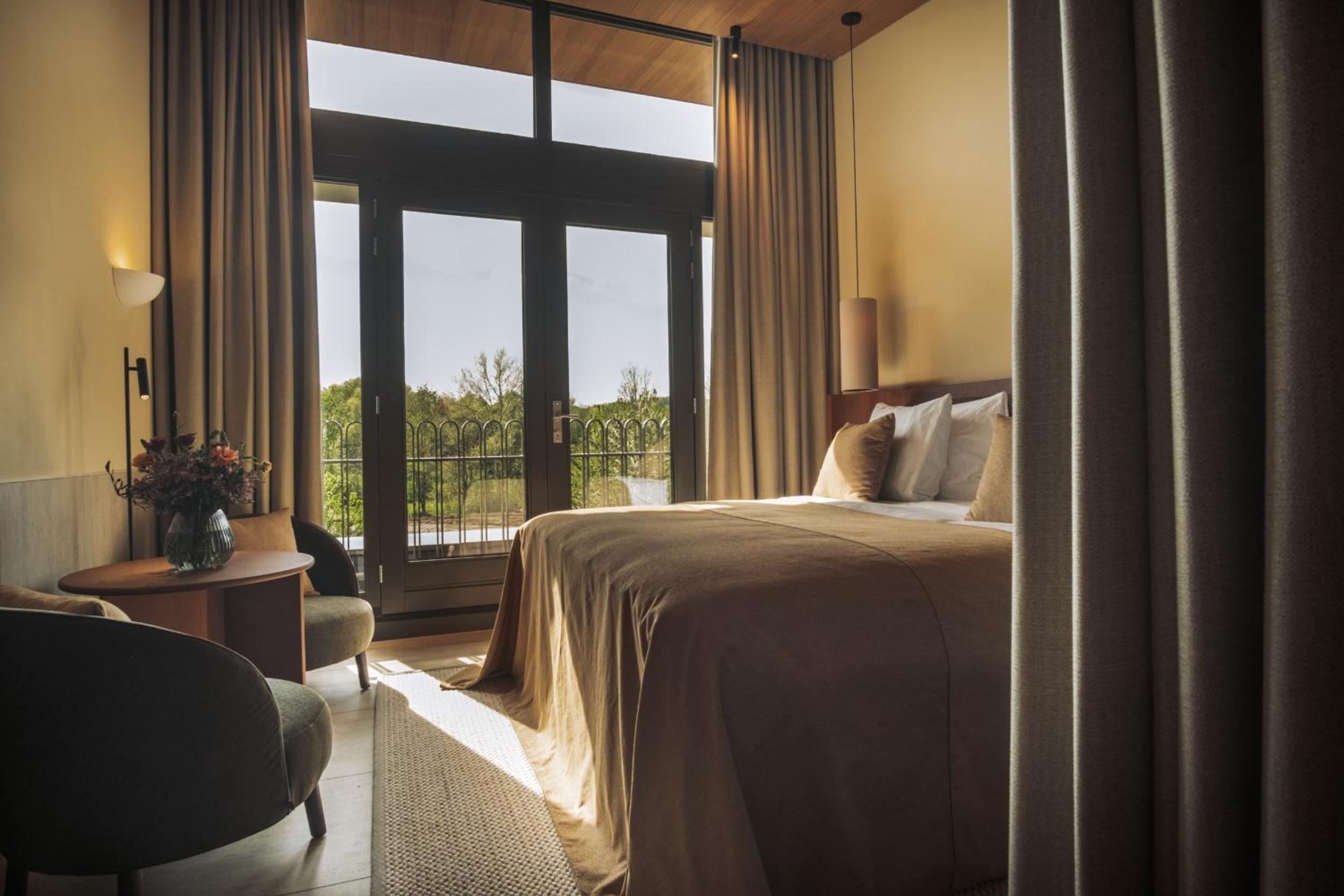 Deluxe Room with Balcony - Photo 3